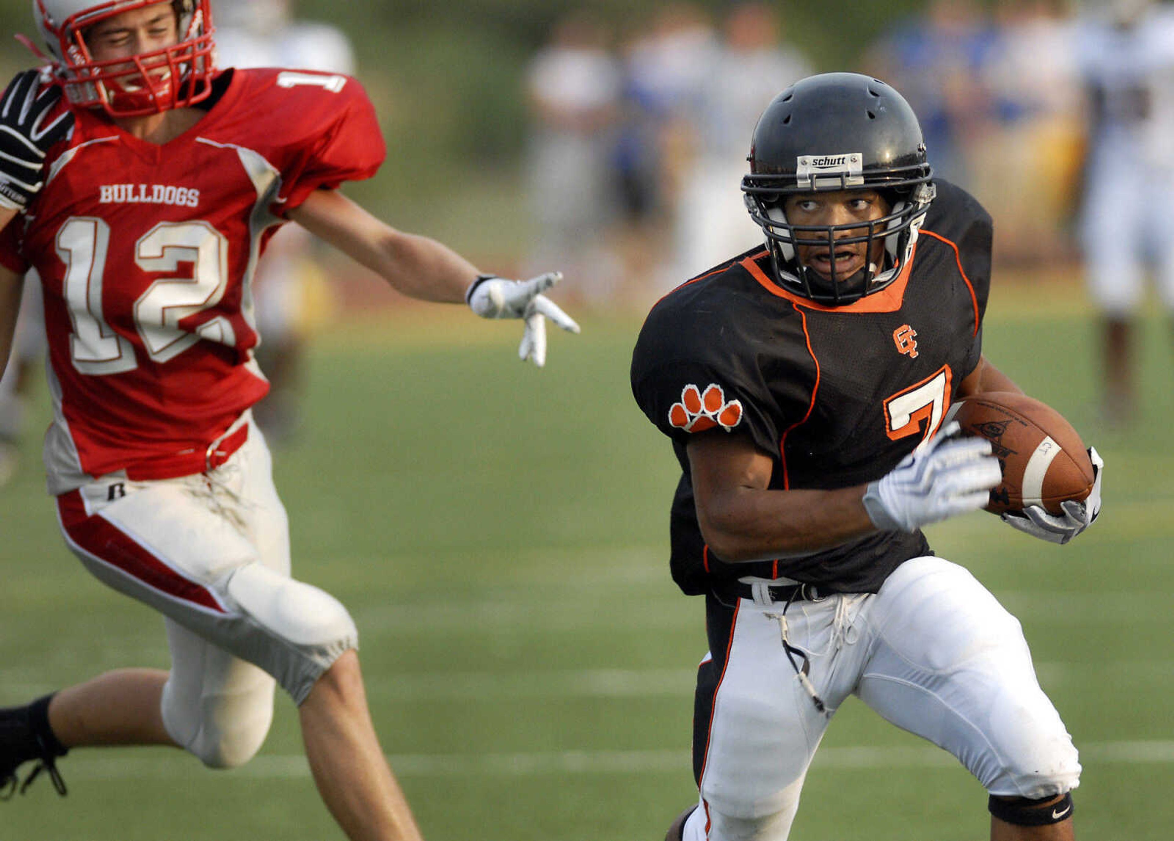 KRISTIN EBERTS ~ keberts@semissourian.com

Cape Central's James Poindexter runs down-field as St. Clair's Tyler Cokley hustles to catch him during a jamboree game on Friday, August 20, 2010, at Farmington High School.