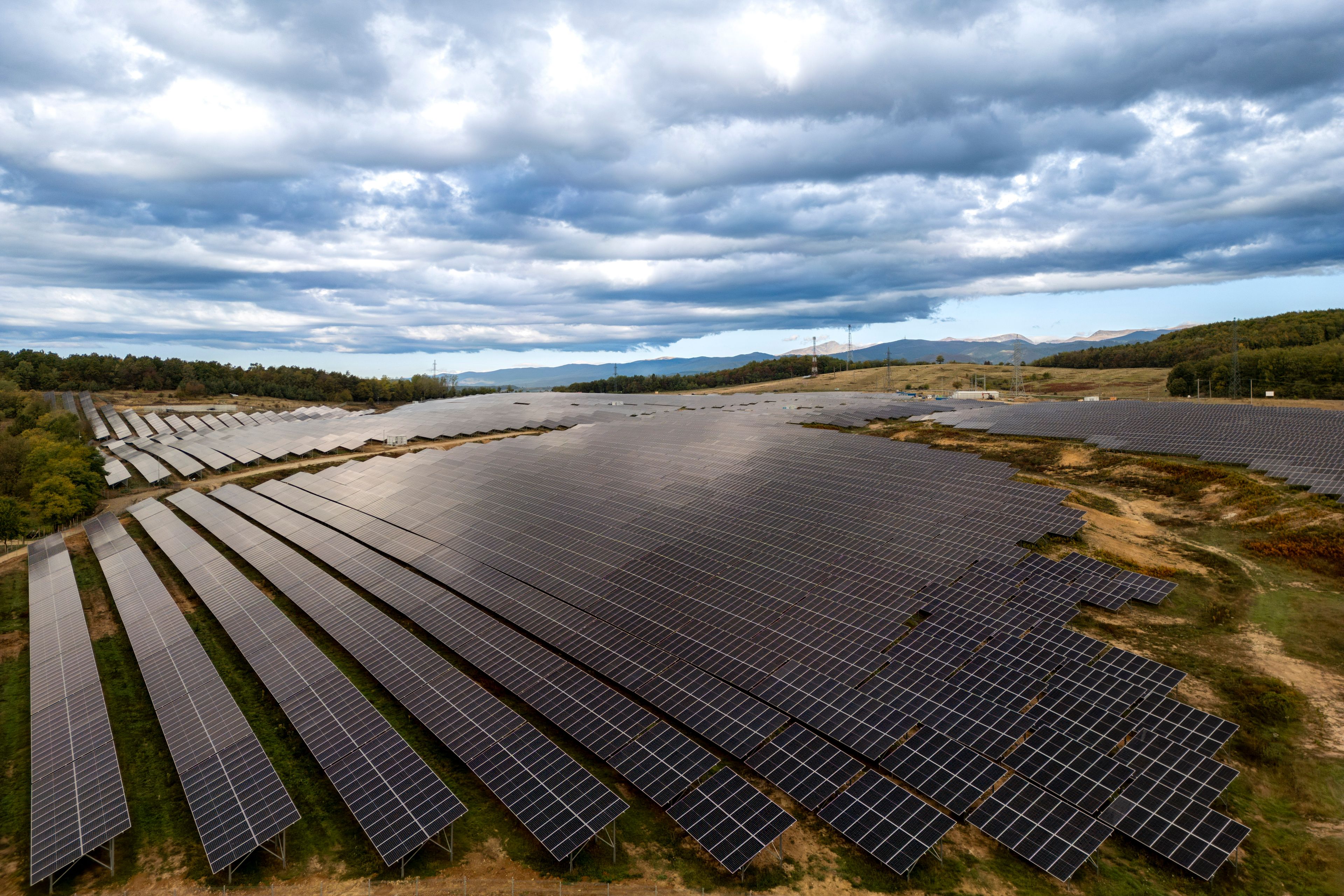 A solar farm, managed by the Chinese CHINT smart energy solutions provider, operates in Slatioara, southern Romania, Saturday, Oct. 12, 2024. (AP Photo/Vadim Ghirda)