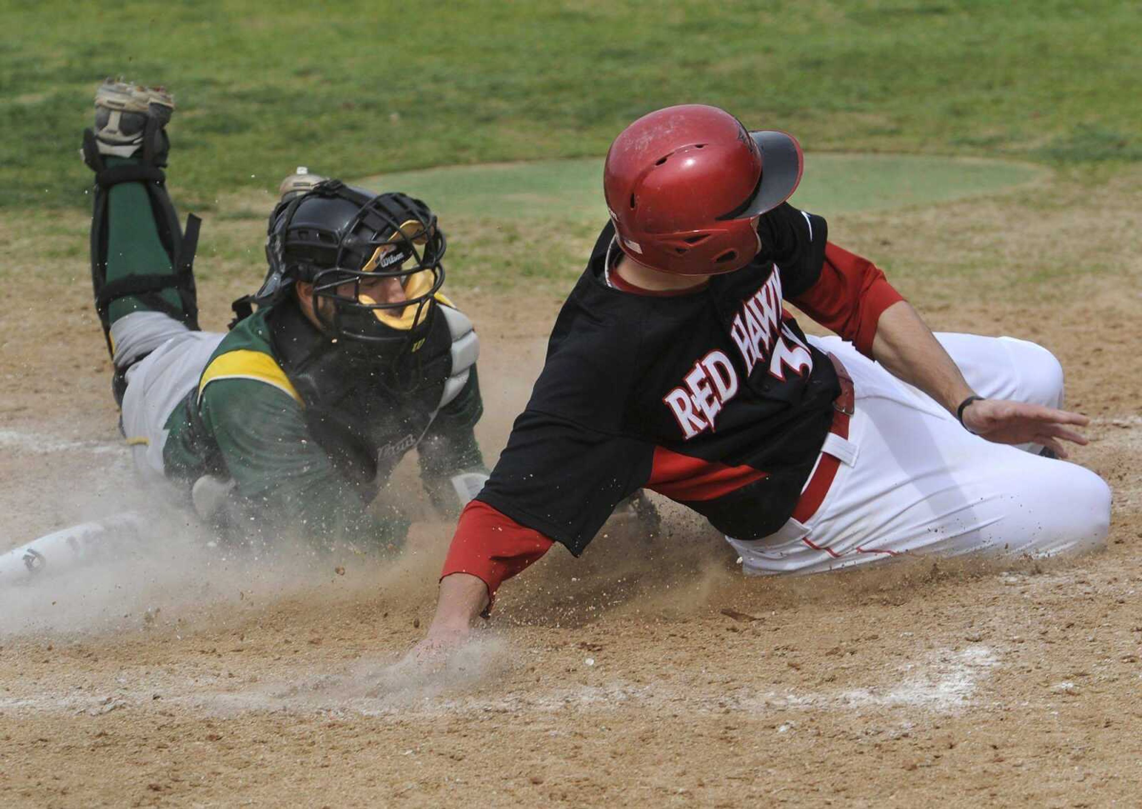 Southeast Missouri State's Tim Rupp avoids a tag by Wright State catcher Corey Davis to score during the sixth inning Saturday at Capaha Field. (Fred Lynch)