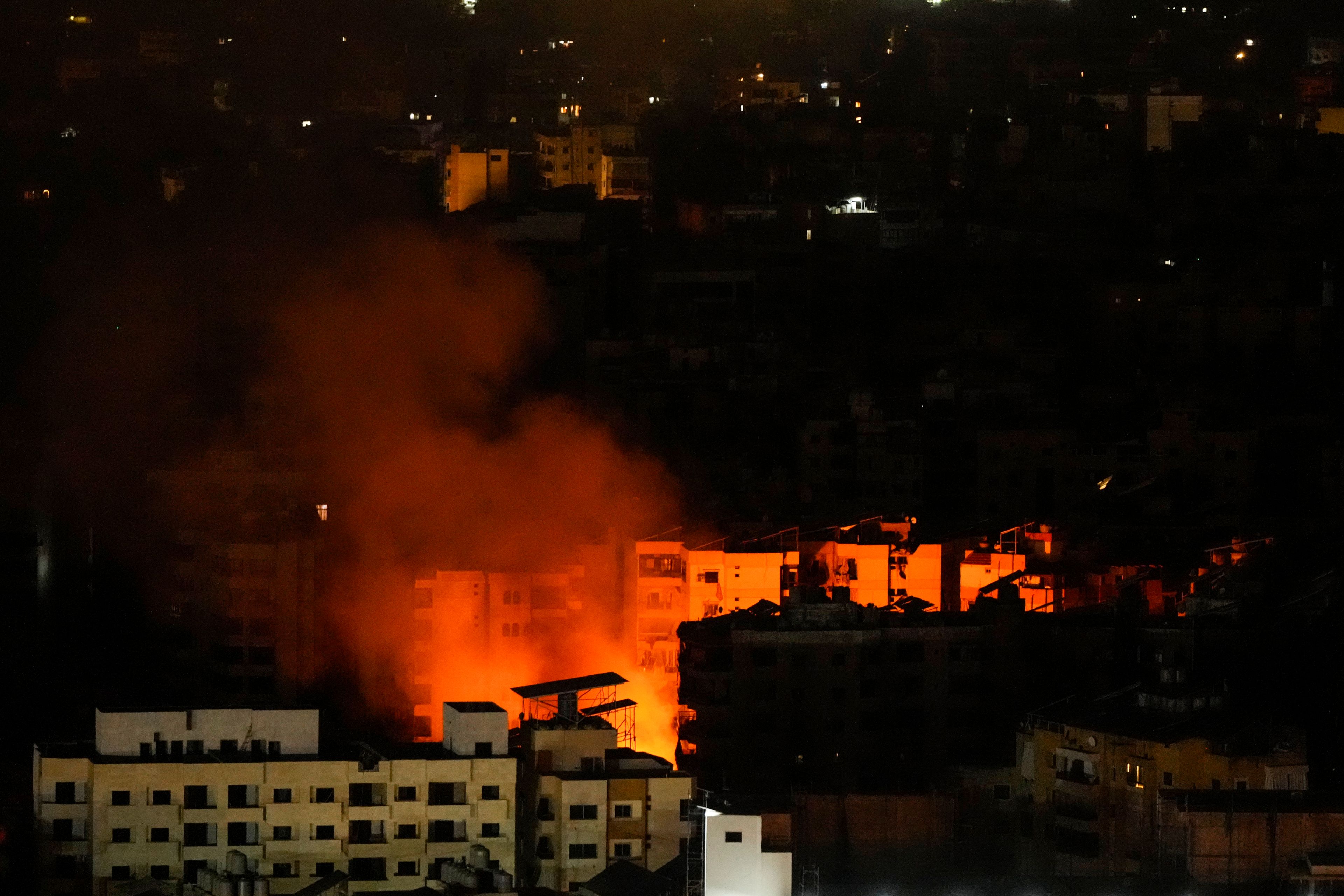 Smoke and fire rise from the site of an Israeli airstrike in Dahiyeh, Beirut, Lebanon, Tuesday, Oct. 8, 2024. (AP Photo/Hassan Ammar)