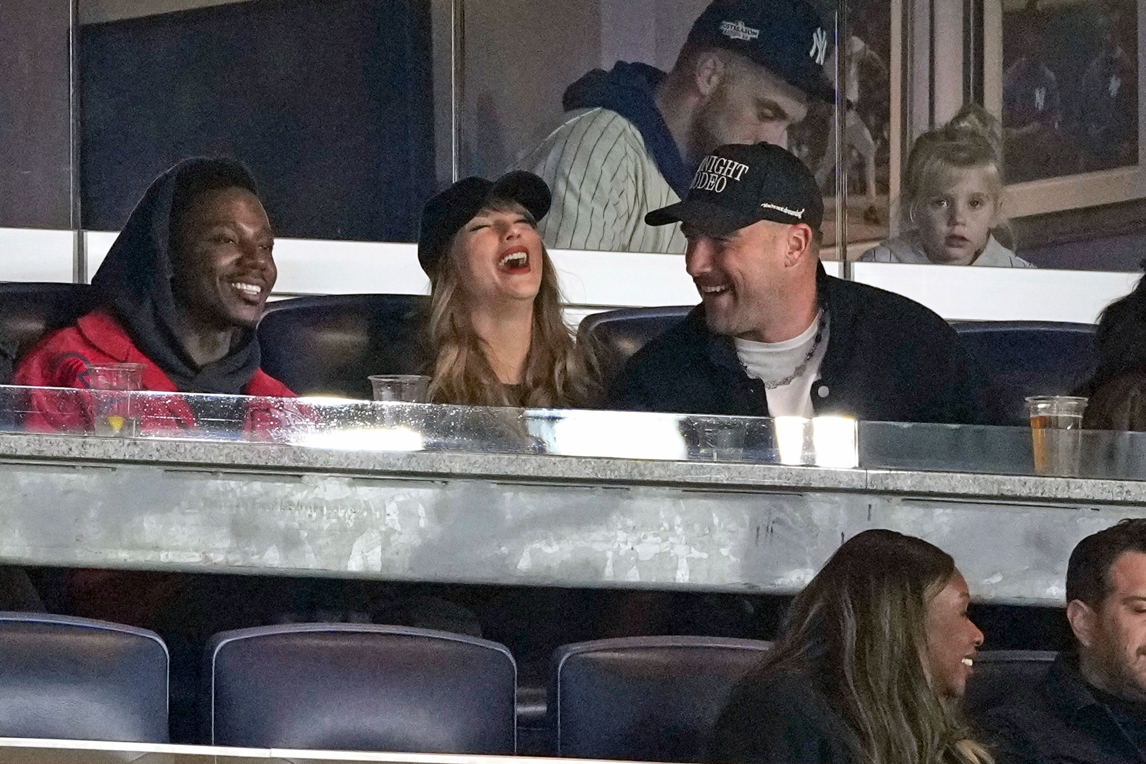 Travis Kelce, right, and Taylor Swift attend Game 1 of the baseball AL Championship Series between the Cleveland Guardians and New York Yankees Monday, Oct. 14, 2024, in New York. (AP Photo/Seth Wenig)