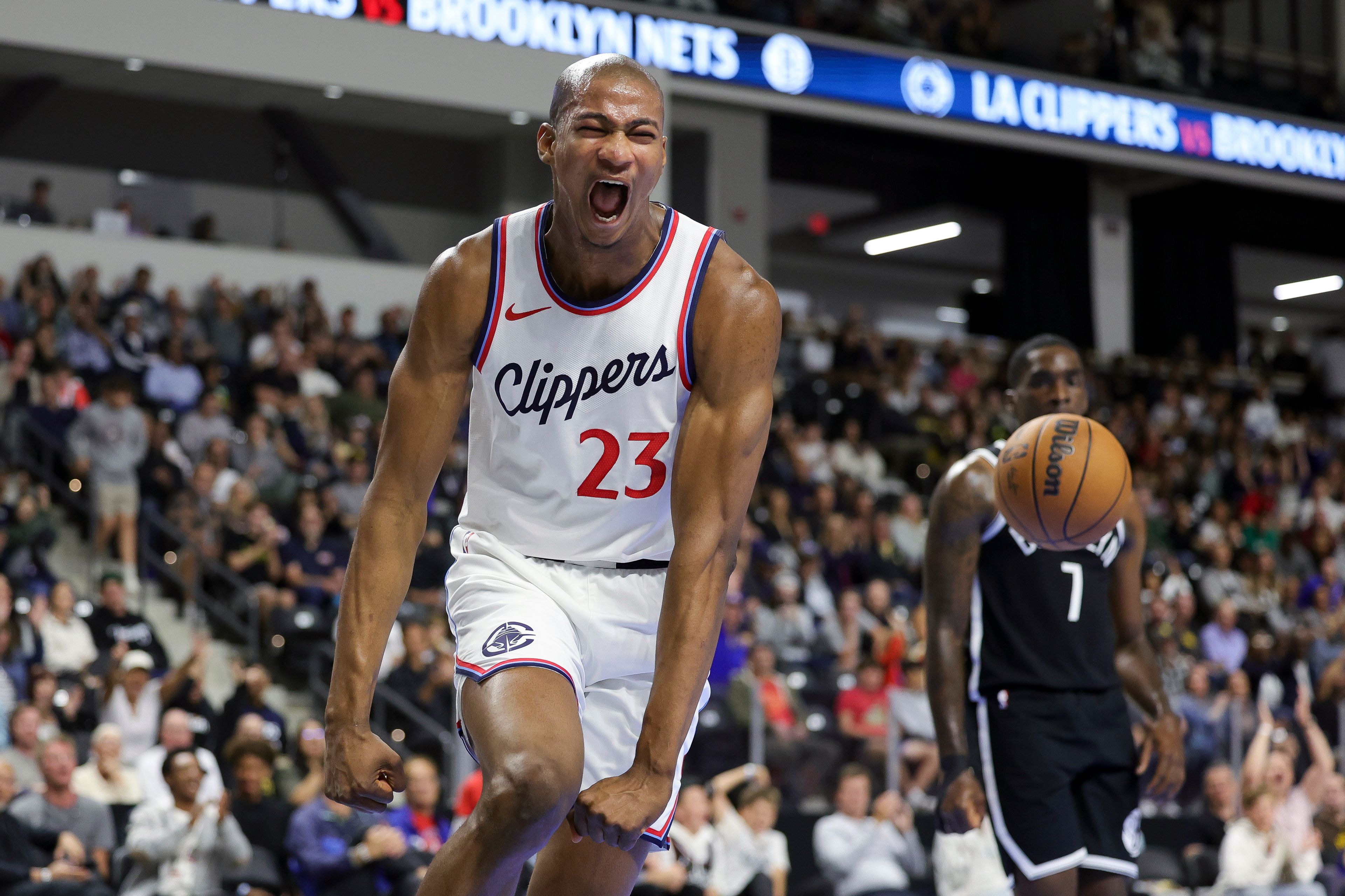 Los Angeles Clippers forward Kai Jones reacts after dunking the ball during the second half of a preseason NBA basketball game against the Brooklyn Nets, Tuesday, Oct. 8, 2024, in Oceanside, Calif. (AP Photo/Ryan Sun)