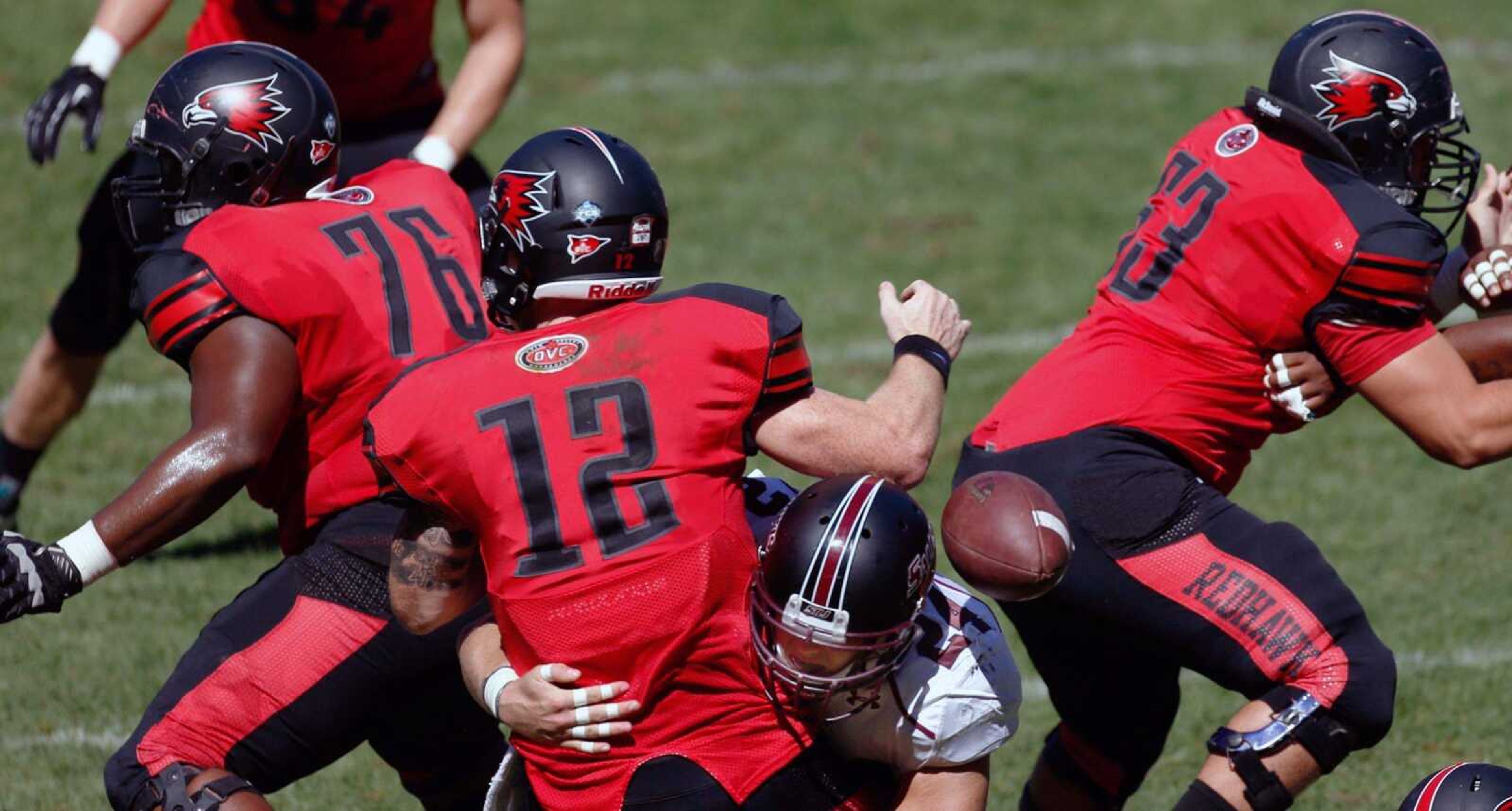 Southern Illinois&#8217; Tyler Williamson jars the ball loose from Southeast quarterback Kyle Snyder for a safety during the second quarter.<br>ROBERT COHEN<br>St. Louis Post-Dispatch