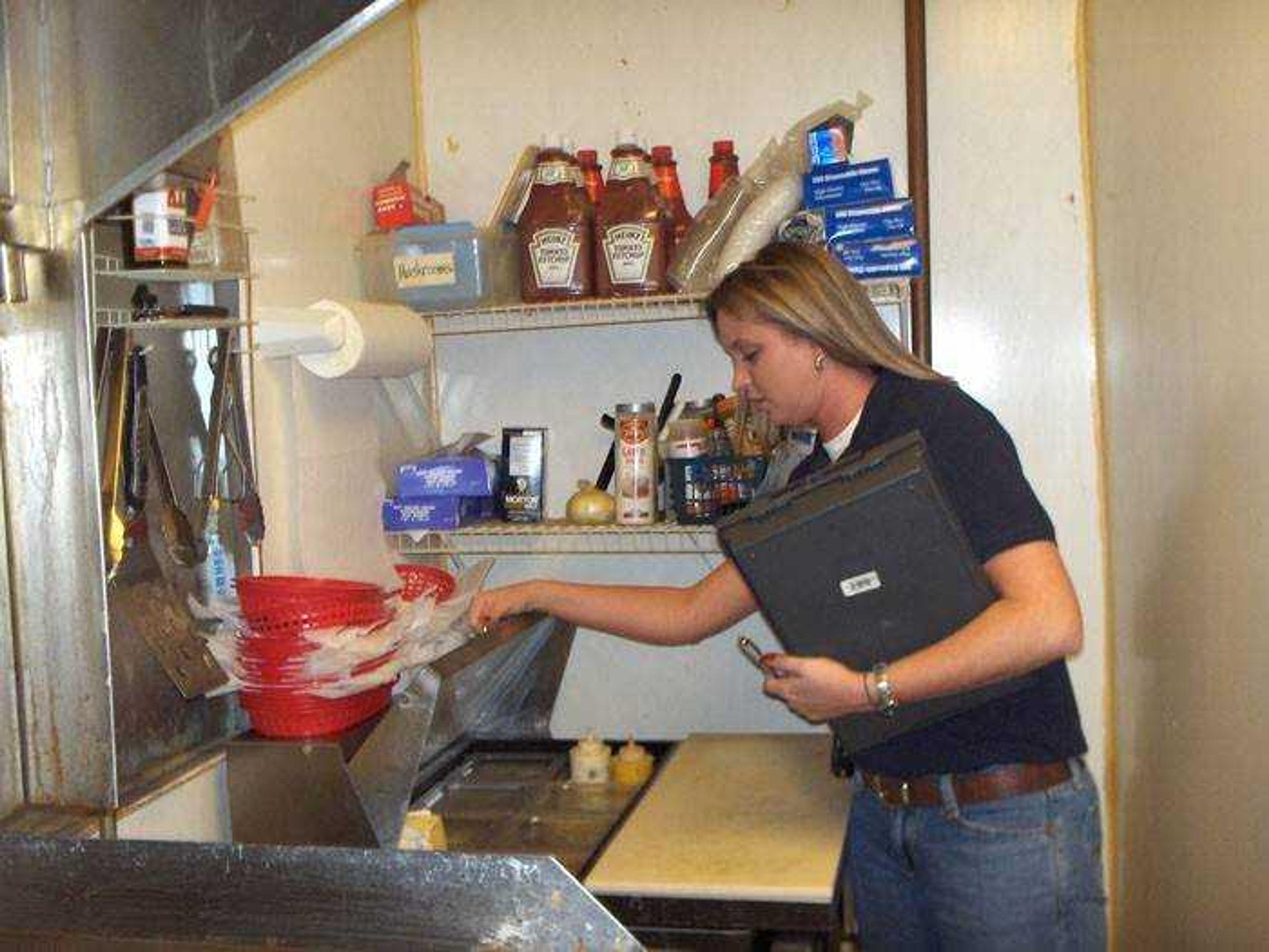 Tenia Porch, Environmental Public Health Specialist, conducts a routine inspection at Break-a-Ways in downtown Cape Girardeau. (Submitted photo)