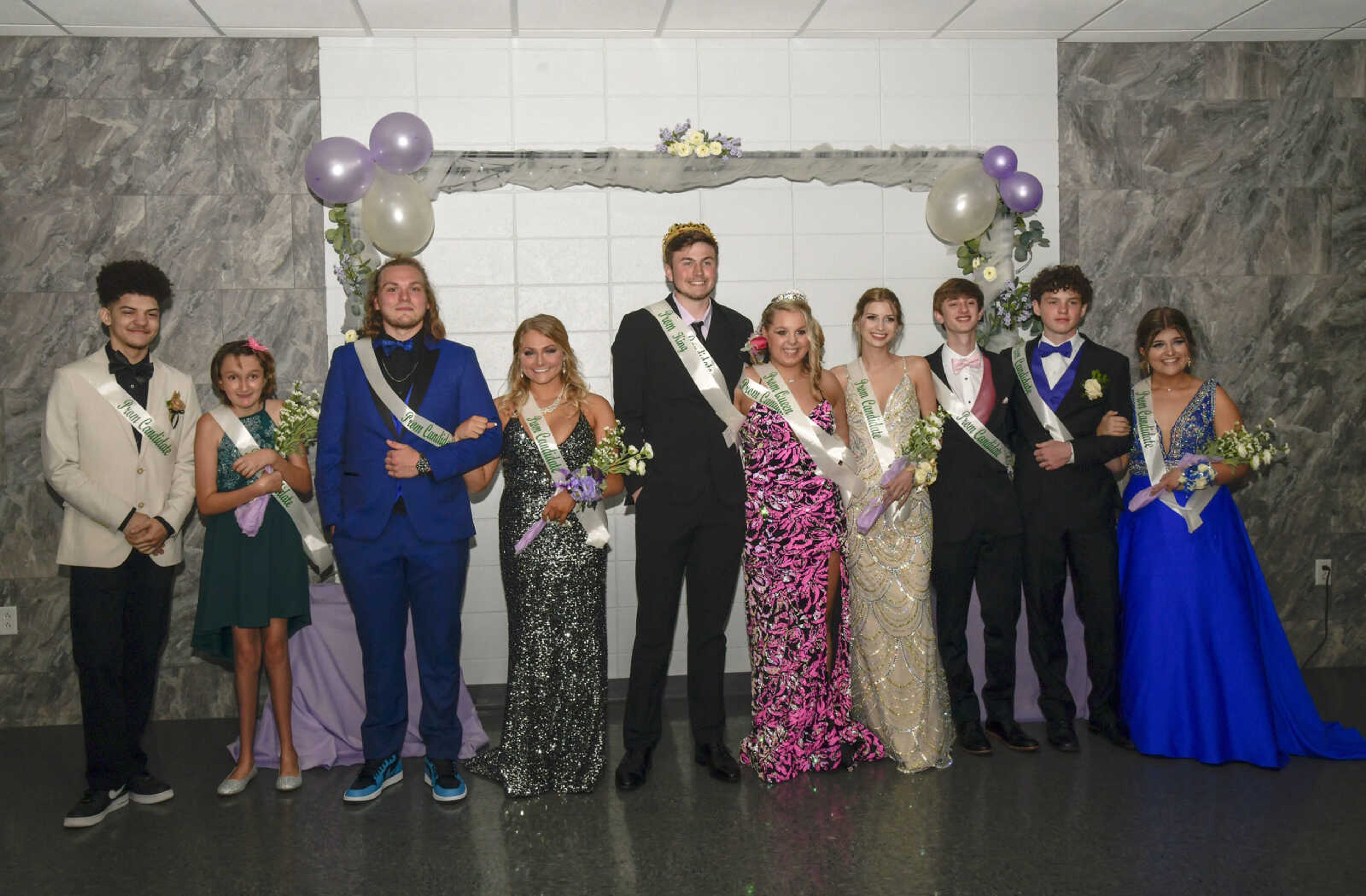 Members of the prom committee pose for a picture at the Front Porch in Scott City on Saturday, April 24, 2021. From left to right, Noah Rushing, Barbara Flowers, Ethan Pennington, Taylor Kuesner, prom king Cayden Beussink, prom queen Olivia Ourth, Olivia Armstrong, Bradon Carman, Lucas Jordan and Henrlie Umfleet.