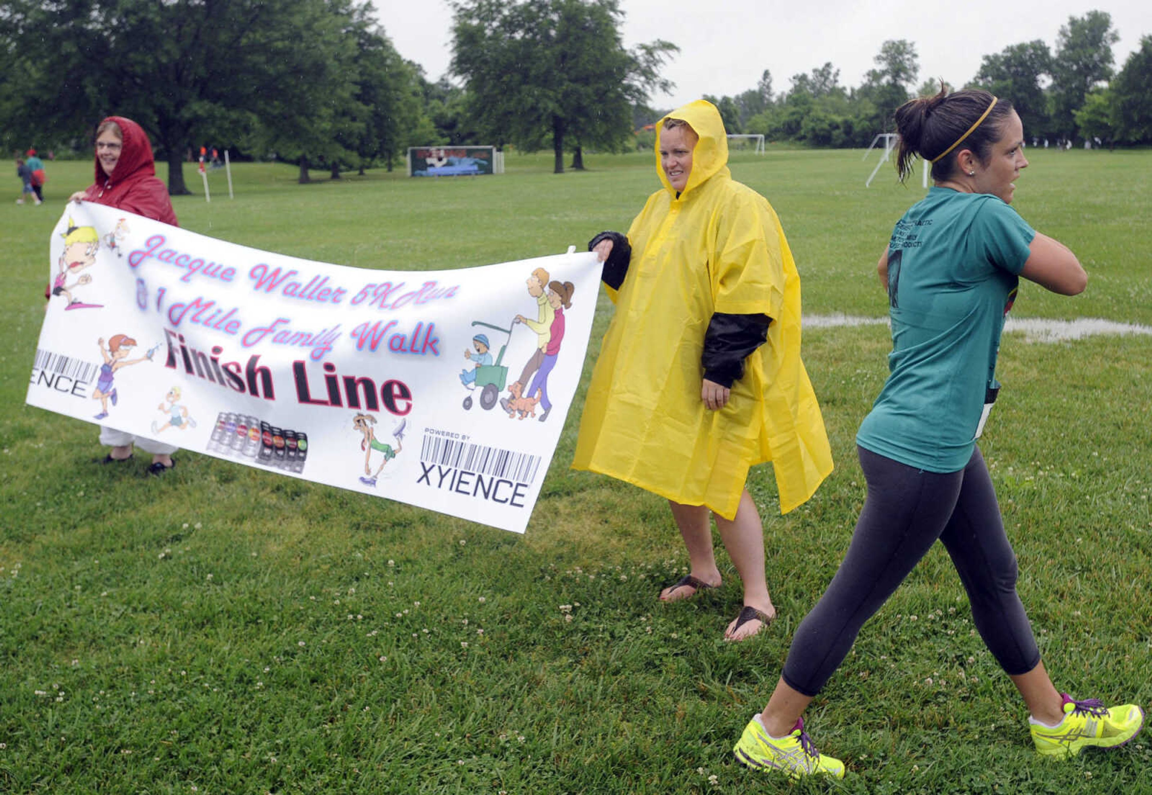 FRED LYNCH ~ flynch@semissourian.com
A runner completes the Jacque Waller 5K run Saturday, June 1, 2013 at Shawnee Park in Cape Girardeau.