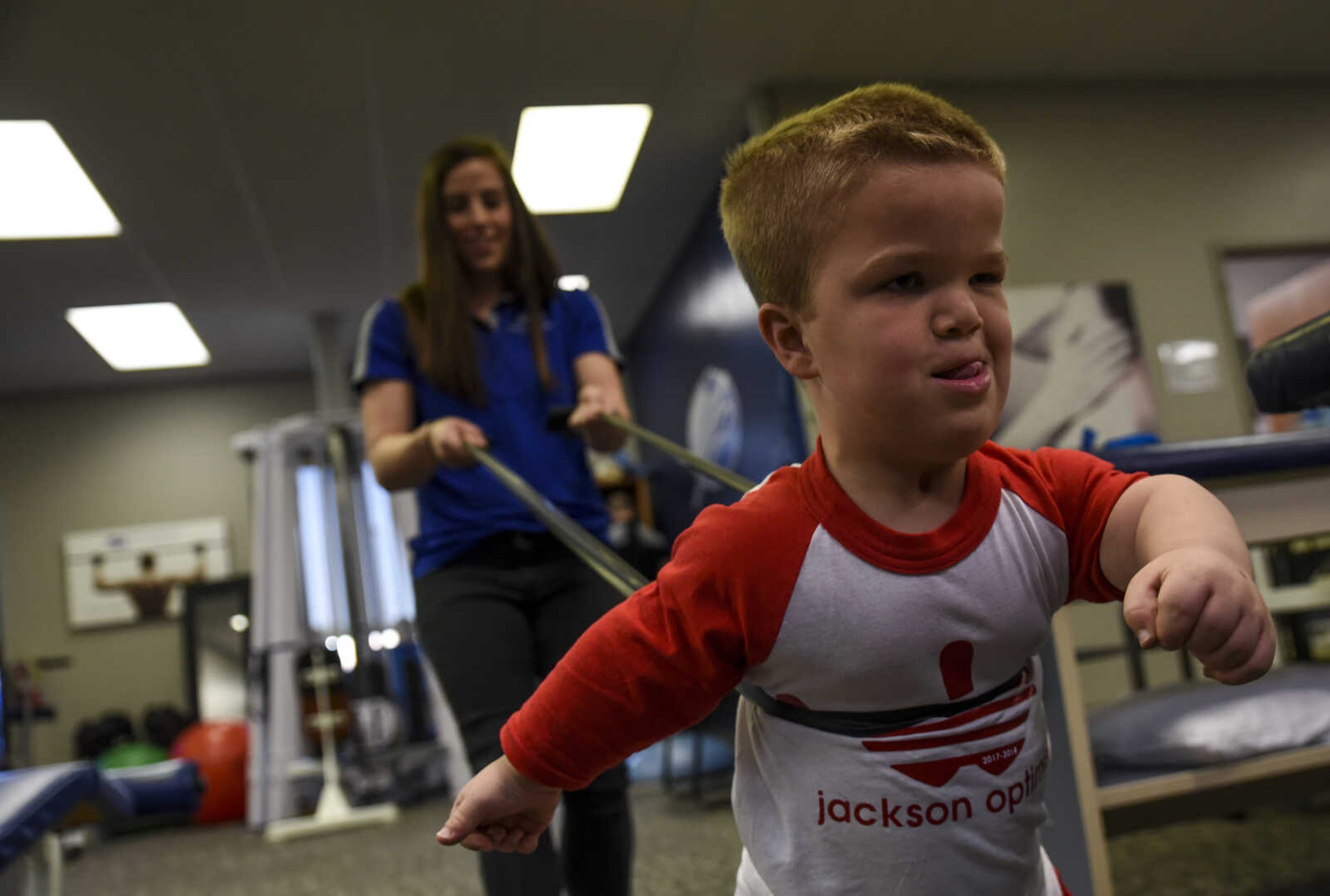 Izaac Pursley does a physical therapy exercise with physical therapist Katie Schaal during his first physical therapy session at Mid America Rehab May 1, 2018 in Cape Girardeau.