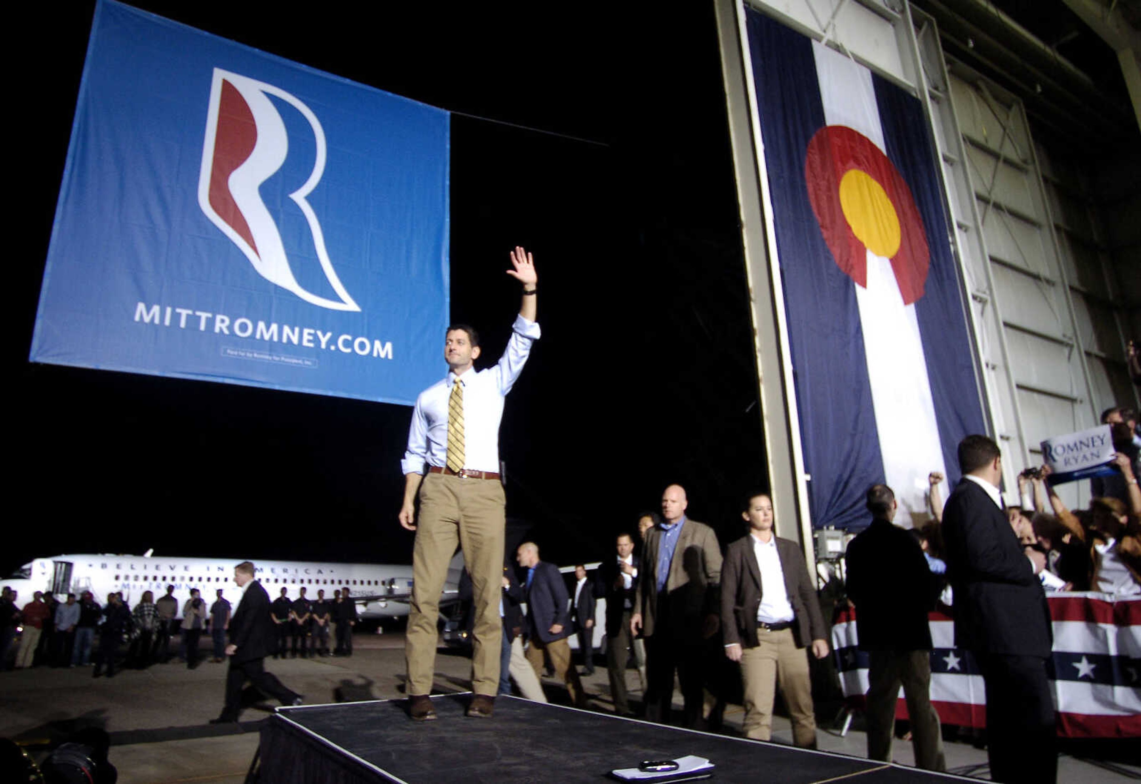 Republican vice presidential candidate, U.S. Rep. Paul Ryan, R-Wis., waves goodbye to hundreds of supporters at the Colorado Jet Center in Colorado Springs, Colo. on Sunday, Oct. 21, 2012 during a campaign stop. (AP Photo/Bryan Oller)