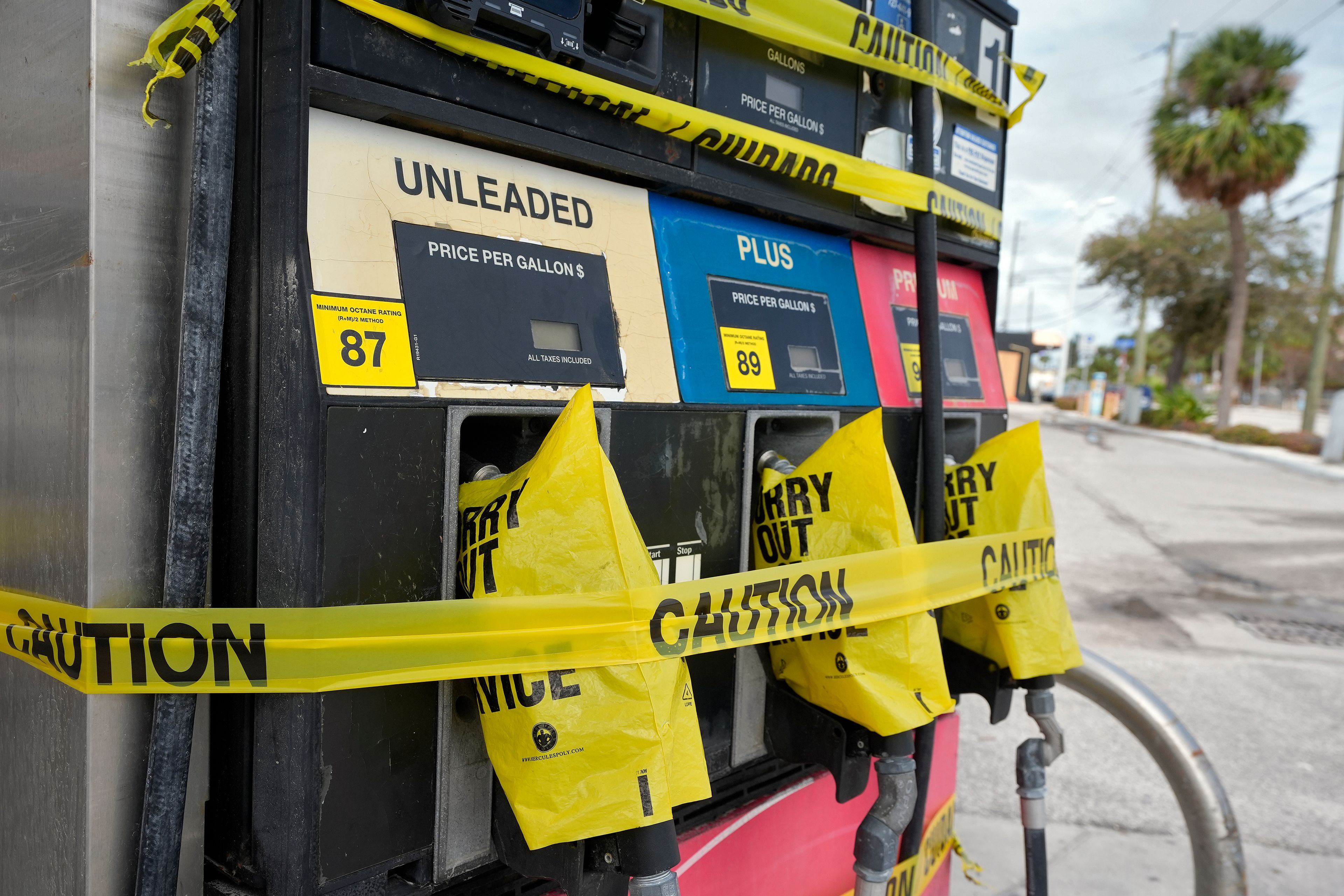 Gas pumps are covered at a station Monday, Oct. 7, 2024, in Clearwater Beach, Fla., ahead of the possible arrival of Hurricane Milton. (AP Photo/Chris O'Meara)