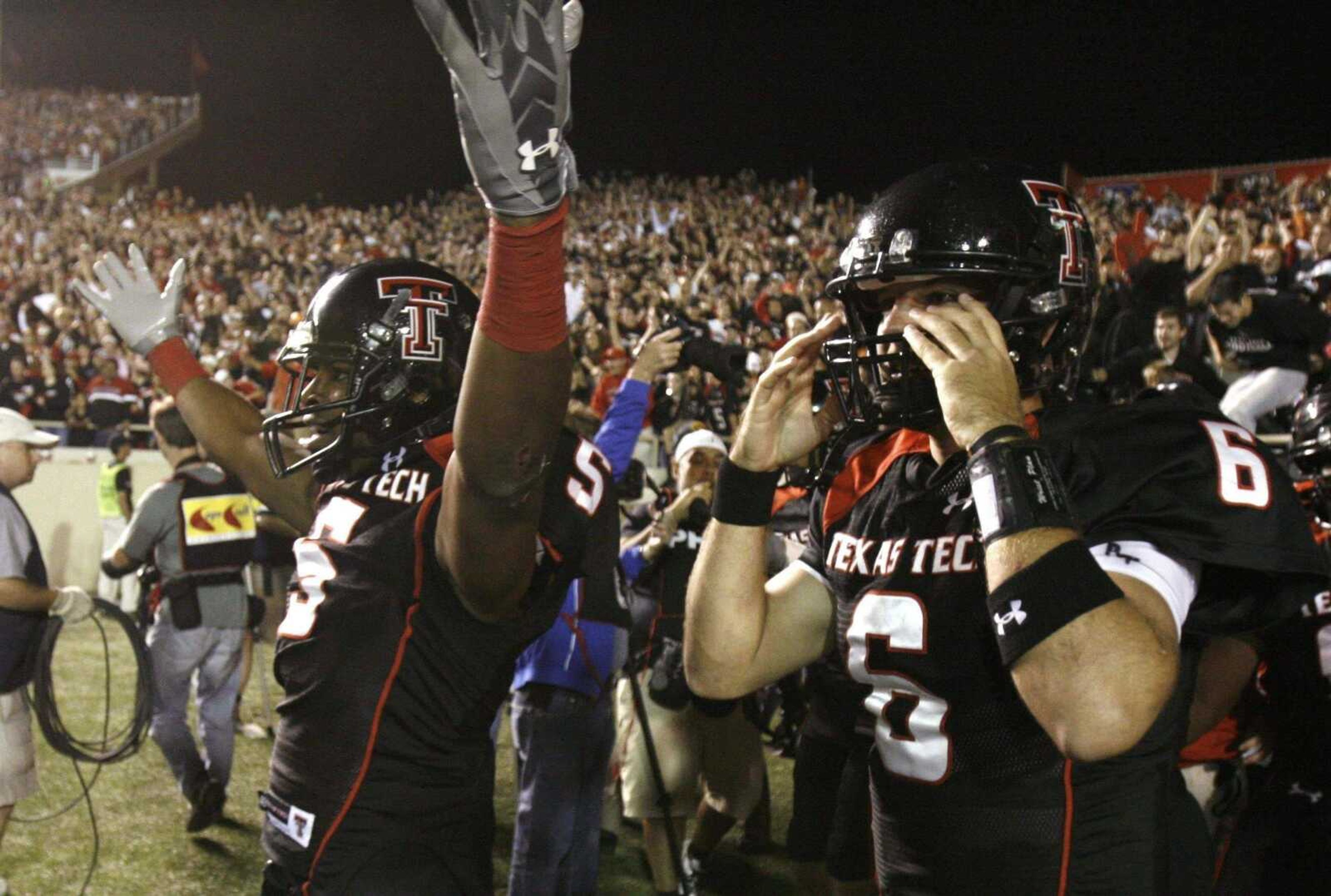 LM OTERO ~ Associated PressTexas Tech wide receiver Michael Crabtree raises his arms after he caught the game-winning pass from quarterback Graham Harrell (6) in the final seconds of Saturday night's game against Texas in Lubbock, Texas.