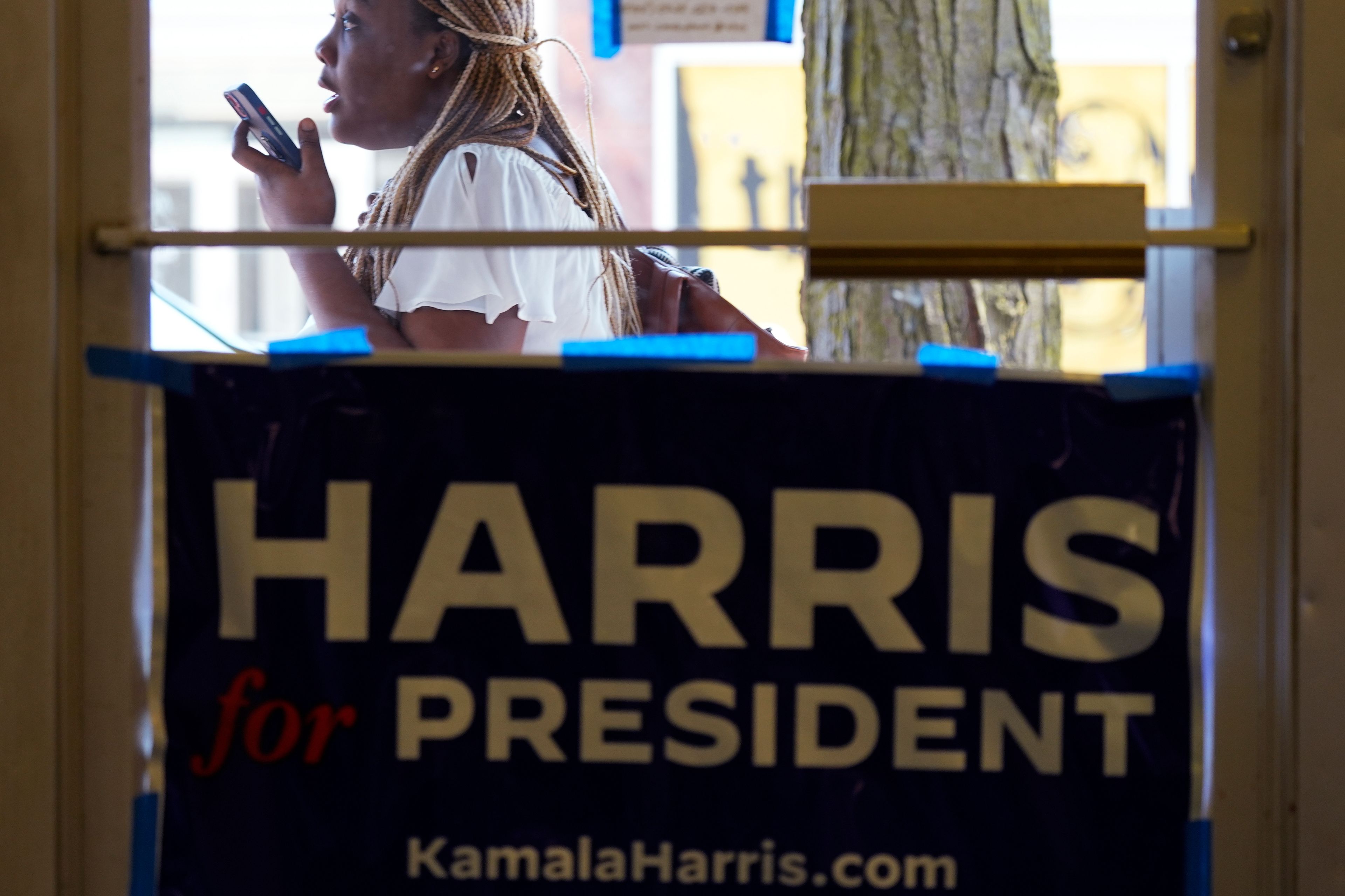 A pedestrian walks past the Waukegan Township Democrats office in Waukegan, Ill., Monday, Sept. 16, 2024. (AP Photo/Nam Y. Huh)