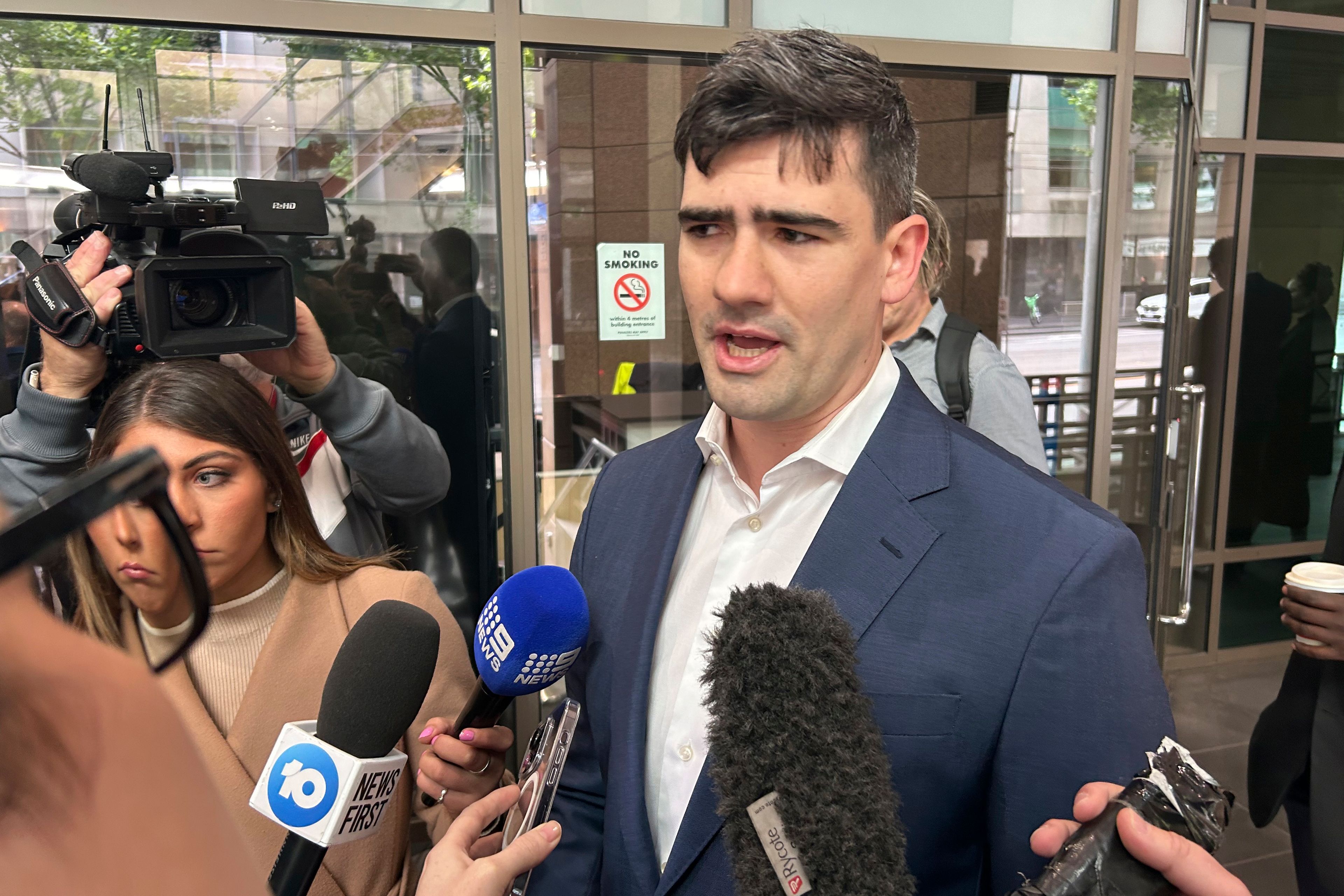 Tim Smartt, the lawyer for Jacob Hersant, arrives at Melbourne Magistrates Court in Melbourne, Australia, Nov. 8, 2024, for Hersant's sentencing after he was convicted for performing the Nazi salute. (AP Photo/Rod McGuirk)