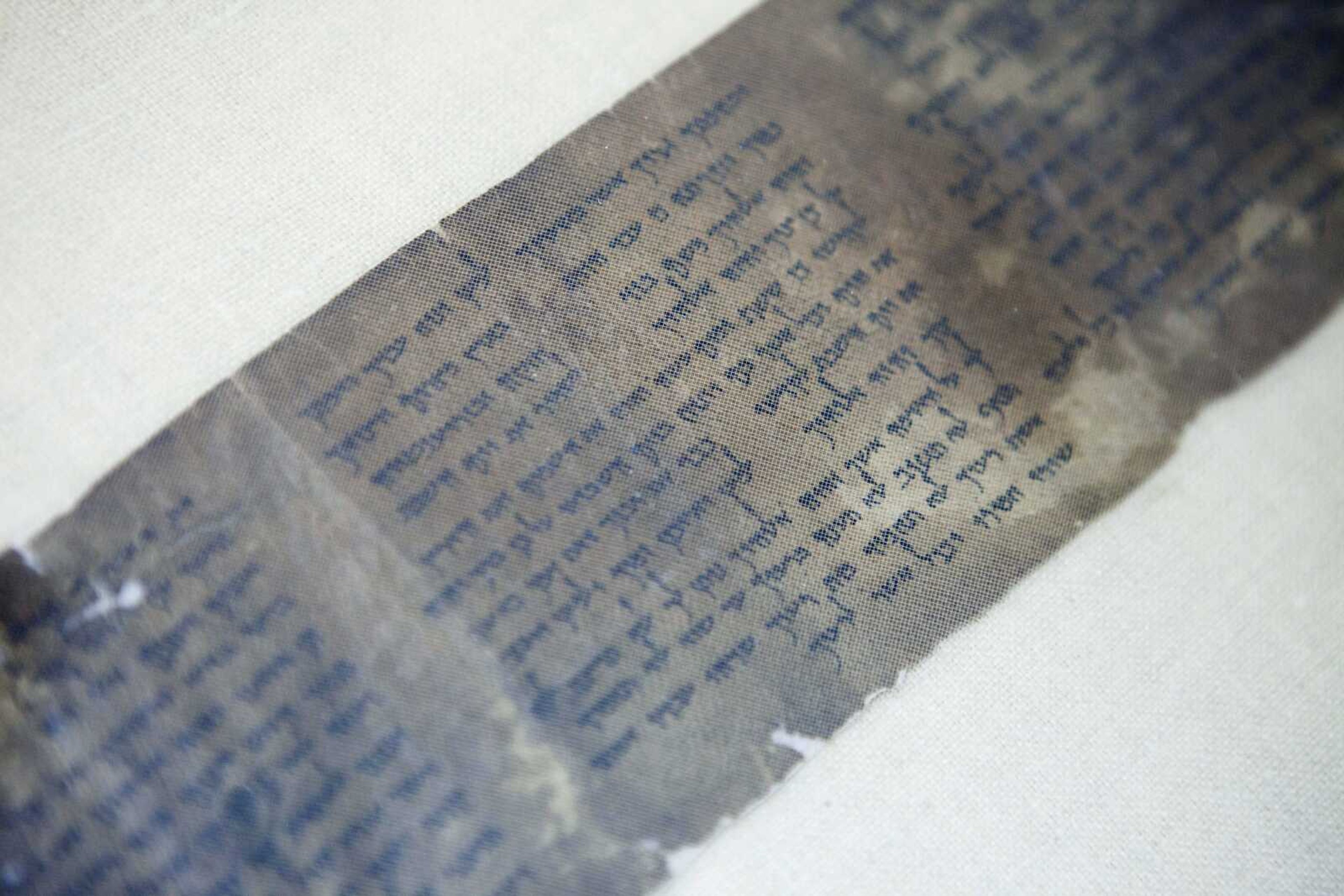 The world's oldest complete copy of the Ten Commandments, written on one of the Dead Sea Scrolls in Jerusalem, is on rare display at Israel's national museum in an exhibit of objects from pivotal moments in the history of civilization. (Dan Balilty ~ Associated Press)