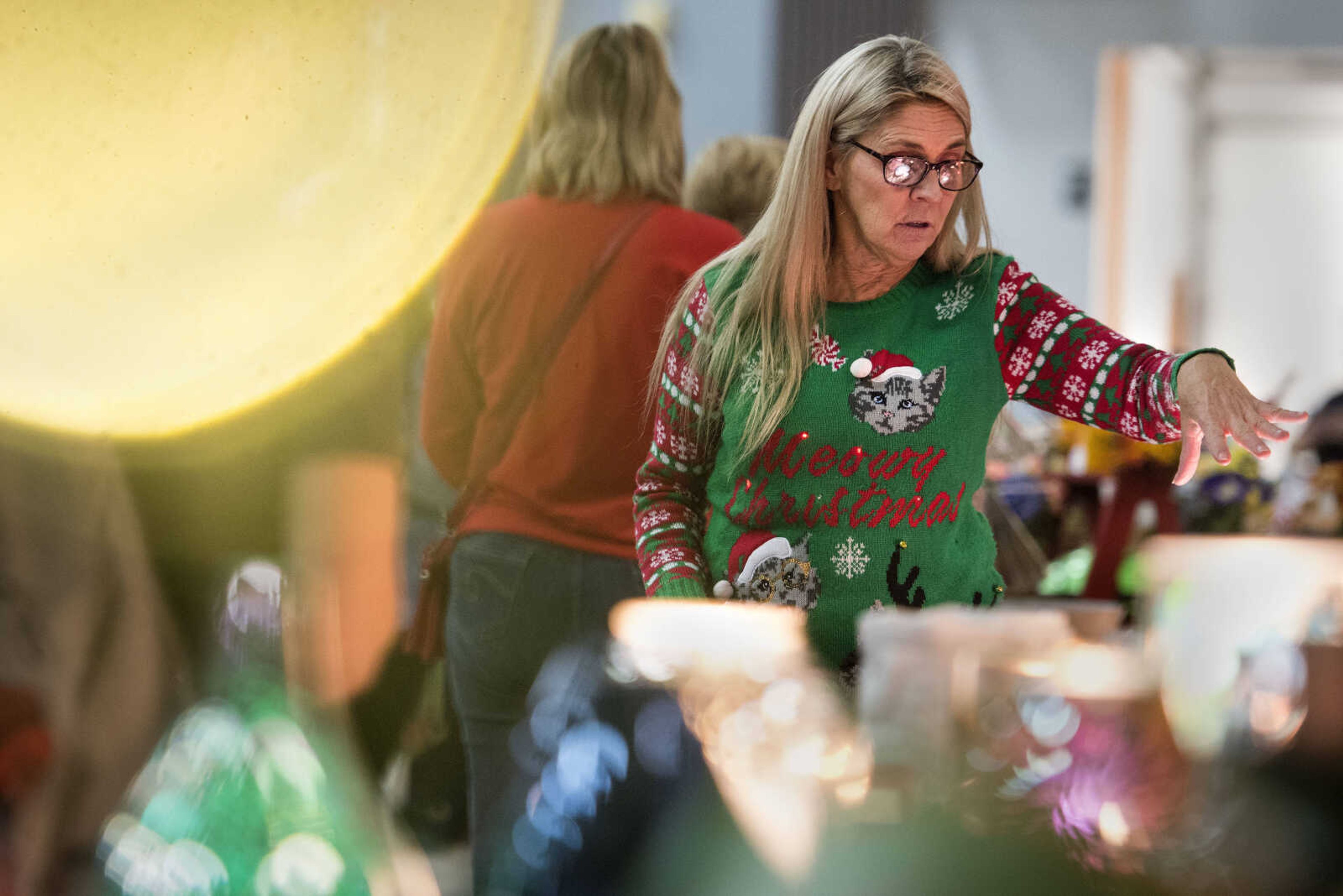 Cape Girardeau vendor Lydia Kern helps a customer at the Arena Building on Saturday, Nov. 17, 2018, during the River Valley Craft Club's 44th annual Christmas Craft Expo in Cape Girardeau.