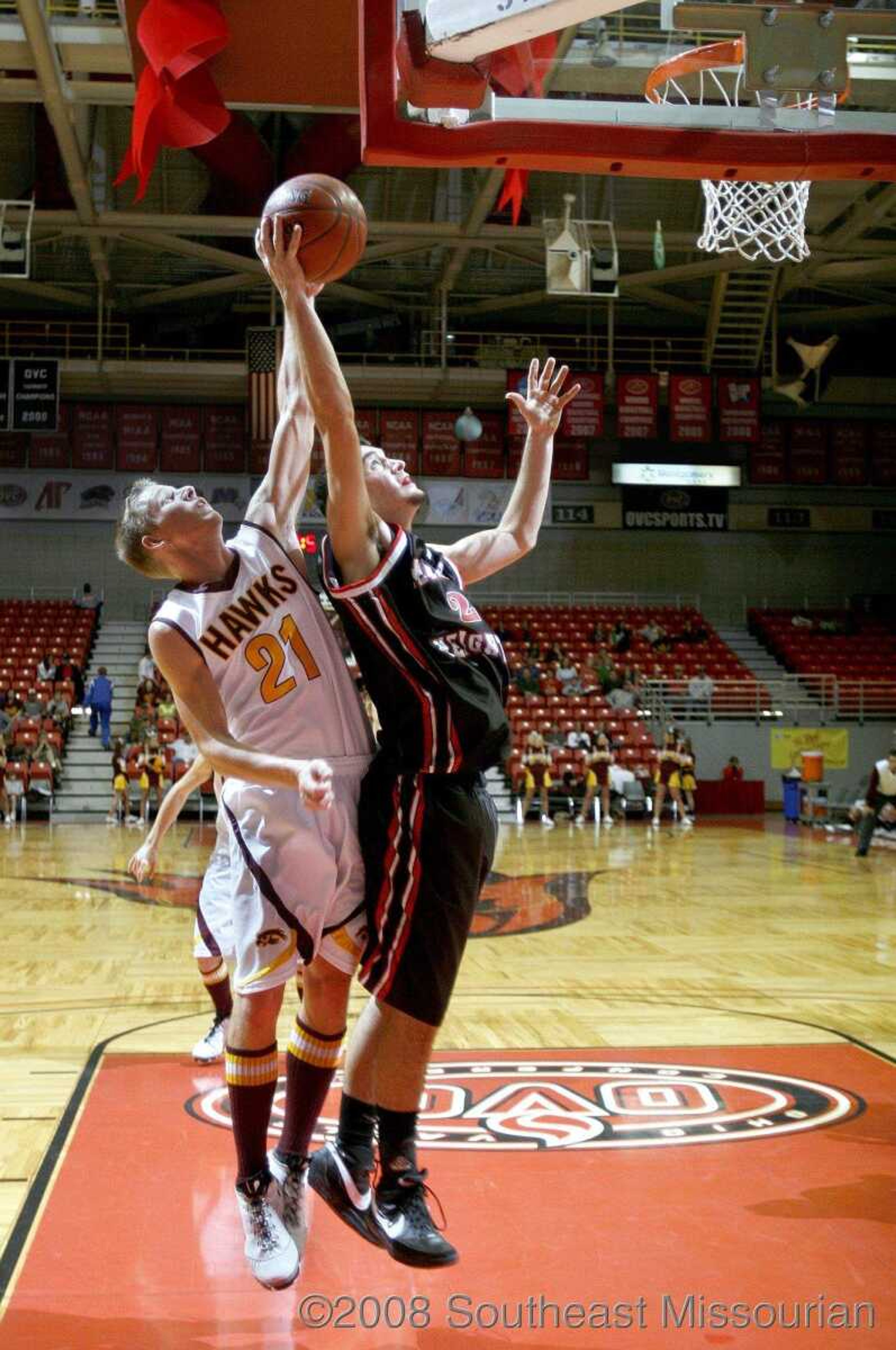 ELIZABETH DODD ~ edodd@semissourian.com
Kelly's Levi Felter, left, and Meadow Heights' Dustin Hubler both try to rebound the ball.