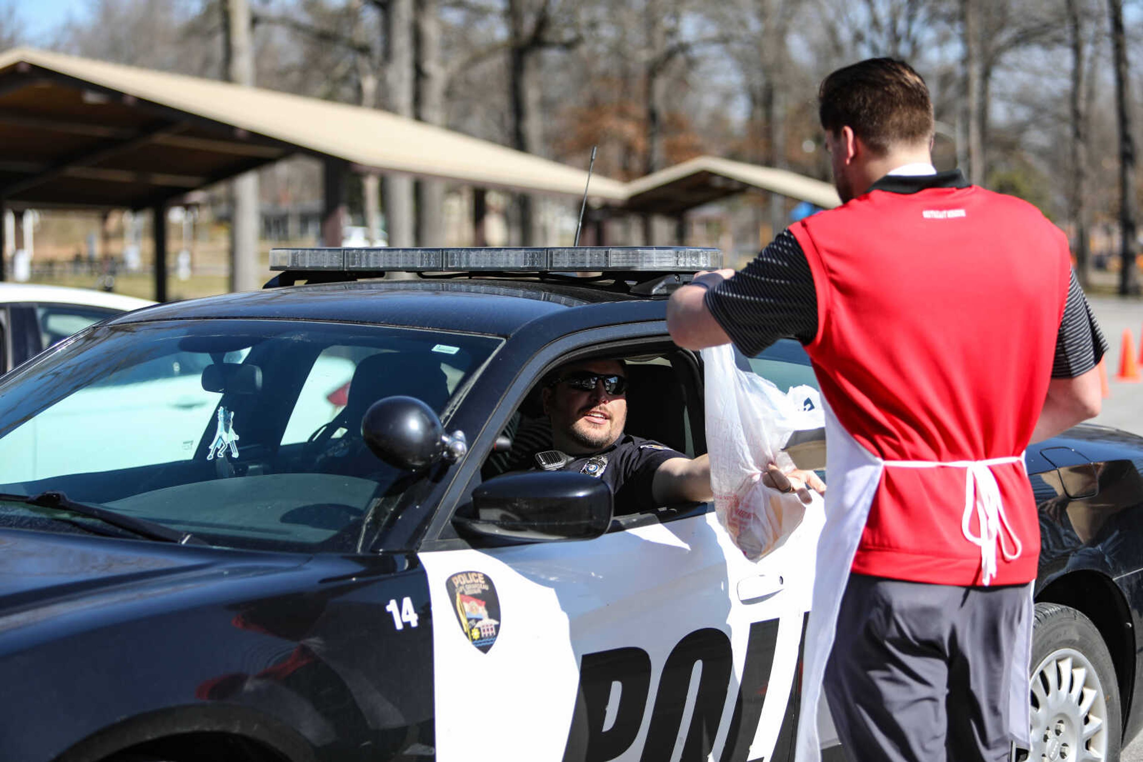 Lions Club member serve a customer.