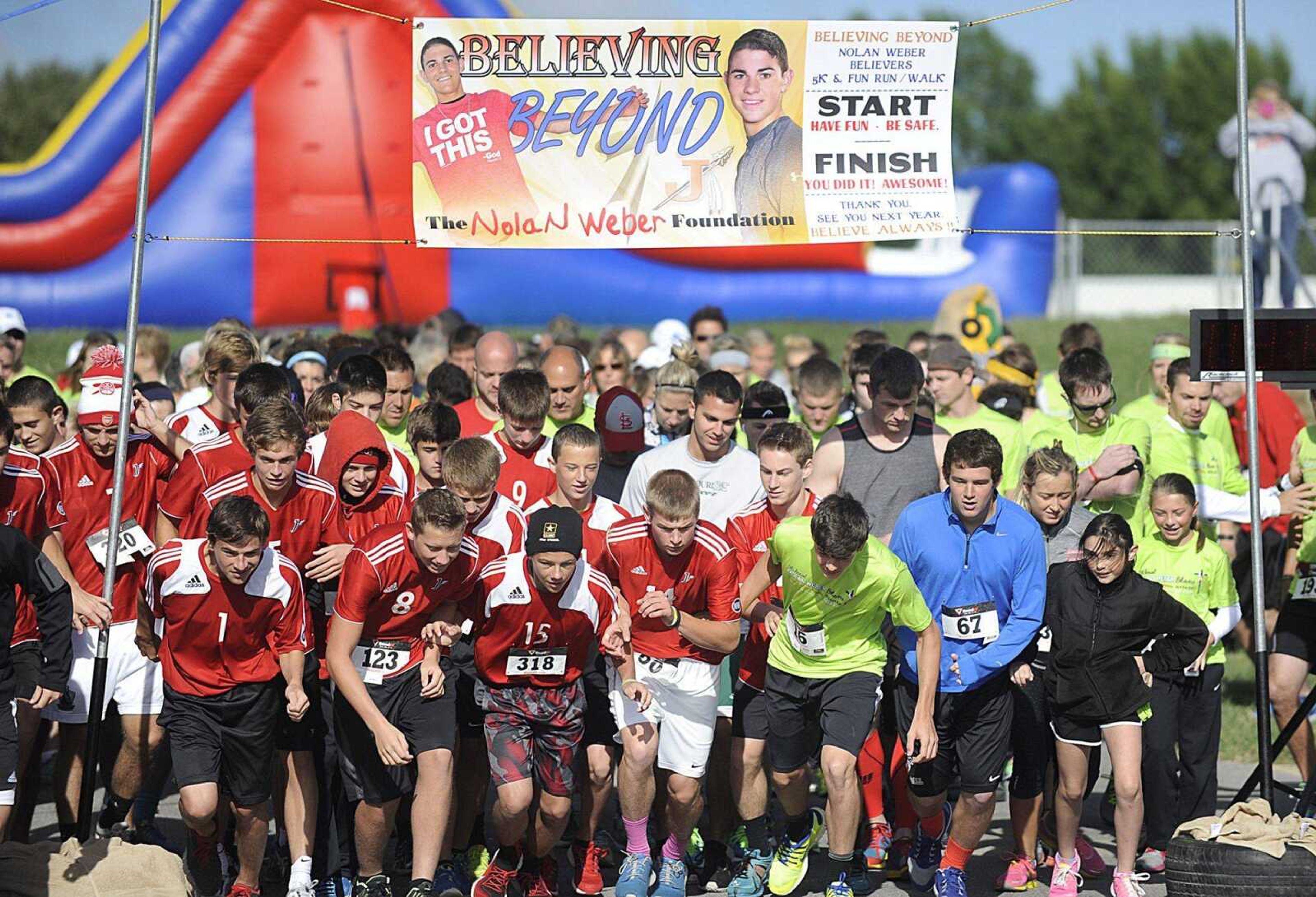 Participants take off from the starting line Sept. 13 during the Nolan Weber Believers 5k and Fun Run in Jackson. (GLENN LANDBERG)