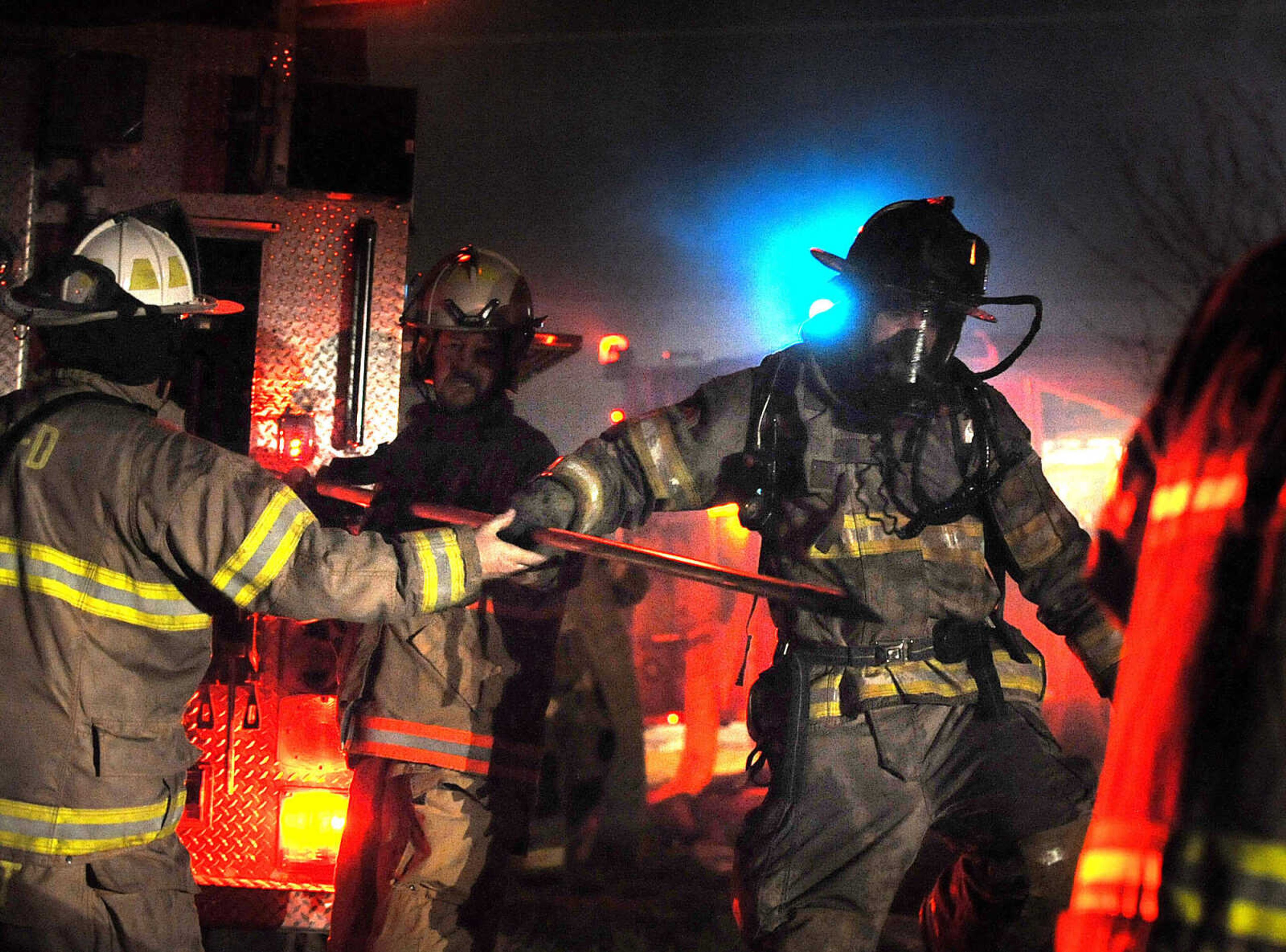 LAURA SIMON ~ lsimon@semissourian.com
Firefighters from Delta, Gordonville, Cape Girardeau, Millersville, Fruitland and East County Fire Departments battle a structure fire Wednesday night, January 9, 2012 on Onyx Lane in Cape Girardeau.