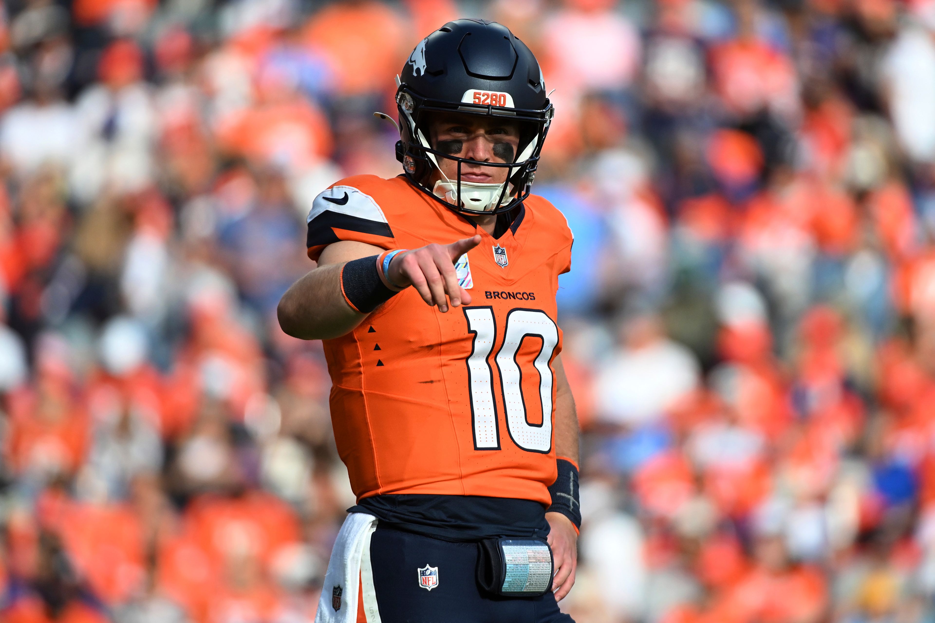 Denver Broncos quarterback Bo Nix (10) points during the second half of an NFL football game against the Los Angeles Chargers, Sunday, Oct. 13, 2024, in Denver. (AP Photo/Geneva Heffernan)