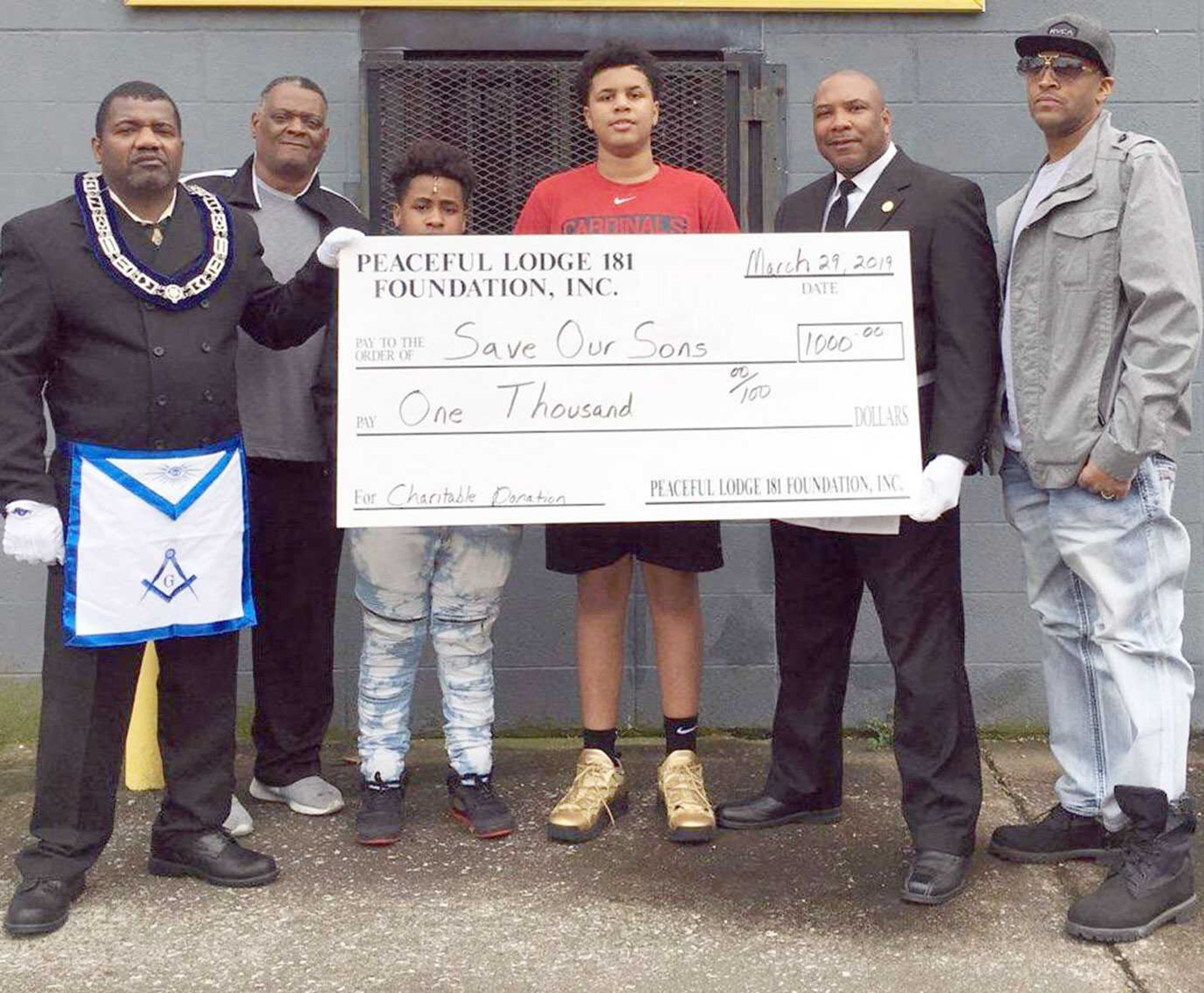 Members of Peaceful Masonic Lodge 181 (Prince Hall-affiliated) recently presented a $1,000 cash donation to the local Save Our Sons organization as part of its first phase to implementing a Paradigm Initiative program.