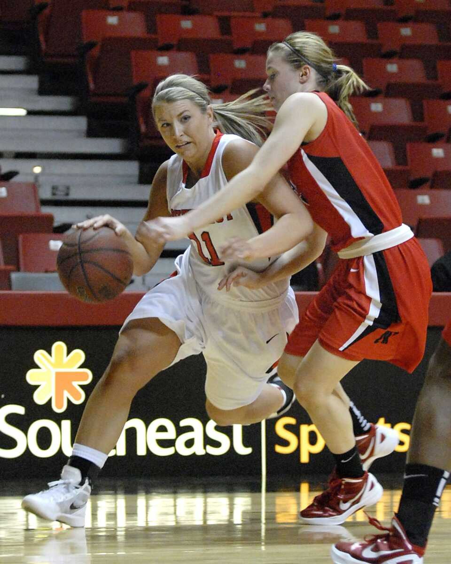 Southeast Missouri State's Allyson Bradshaw drives around Austin Peay's Nicole Olszewski during the first half Monday at the Show Me Center. Bradshaw, who graduated from Notre Dame Regional High School, scored a career-high 17 points Monday. (Kristin Eberts)