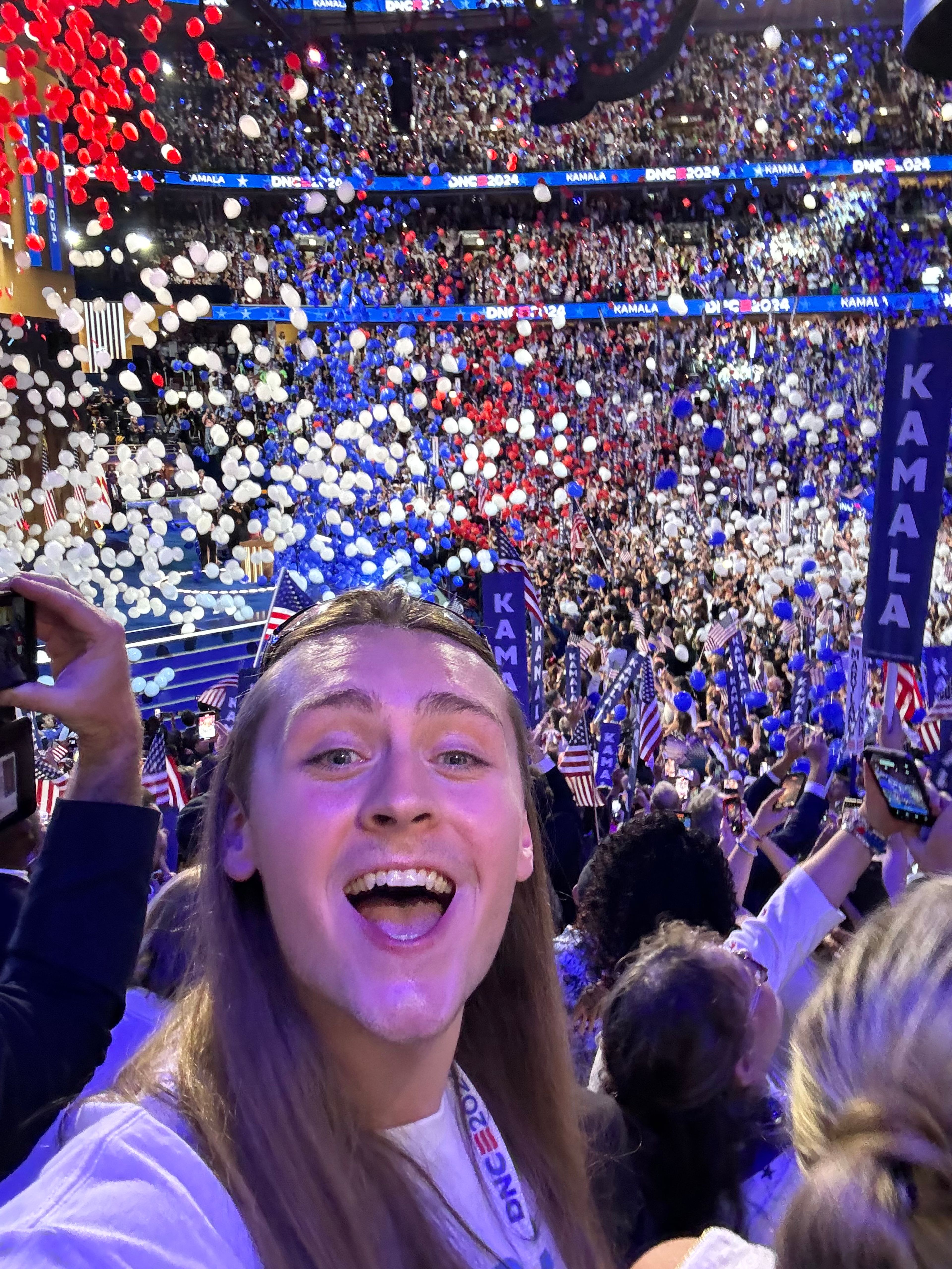 Brock Freeman takes a selfie as balloons drop from the ceiling following presidential-nominee Kamala Harris’ acceptance speech Aug. 22 at the Democratic National Convention in Chicago.