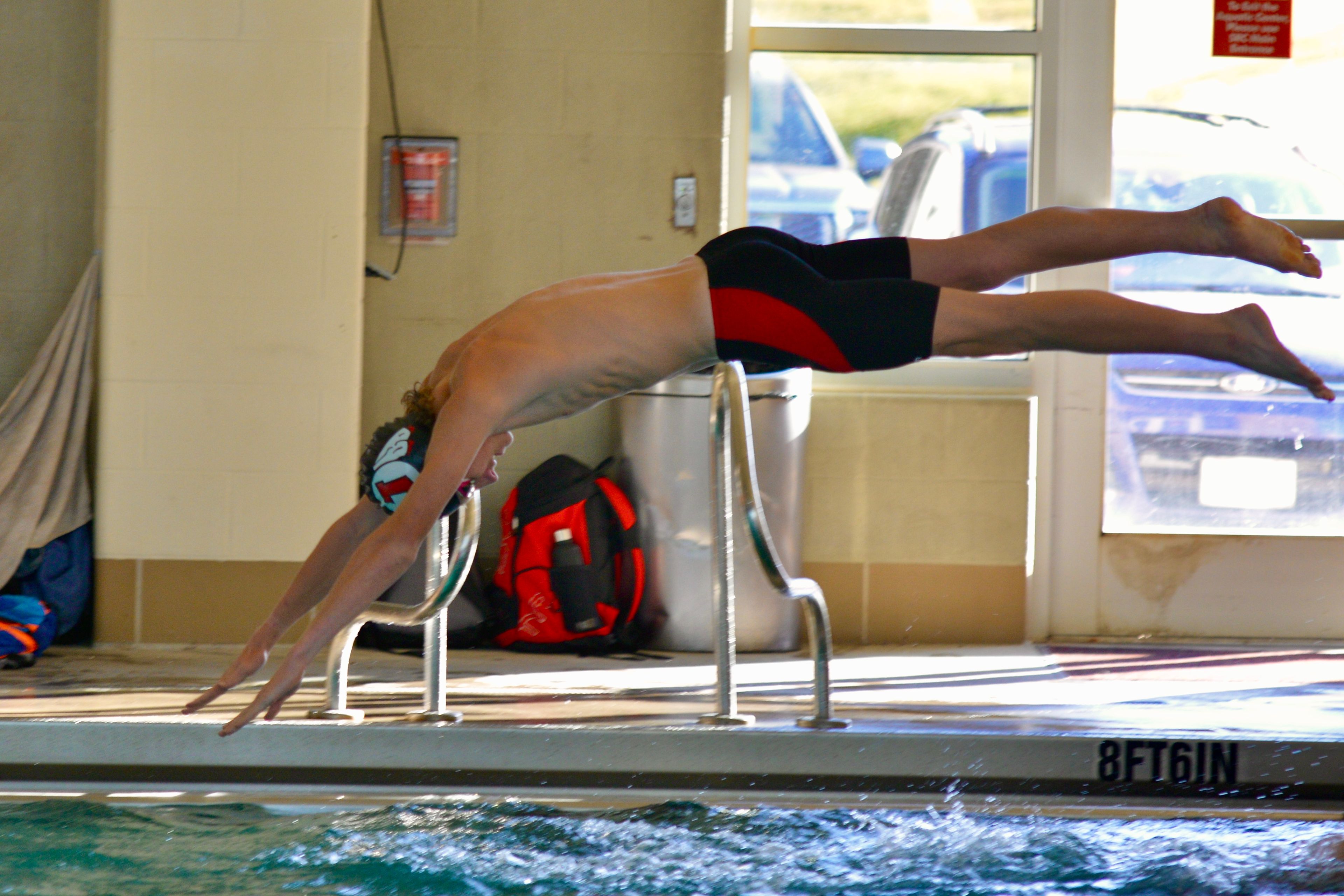 Jackson’s Kenyan Kelpe dives into the pool during the Rec Relays on Monday, Oct. 21, at the SEMO Recreation Center. 