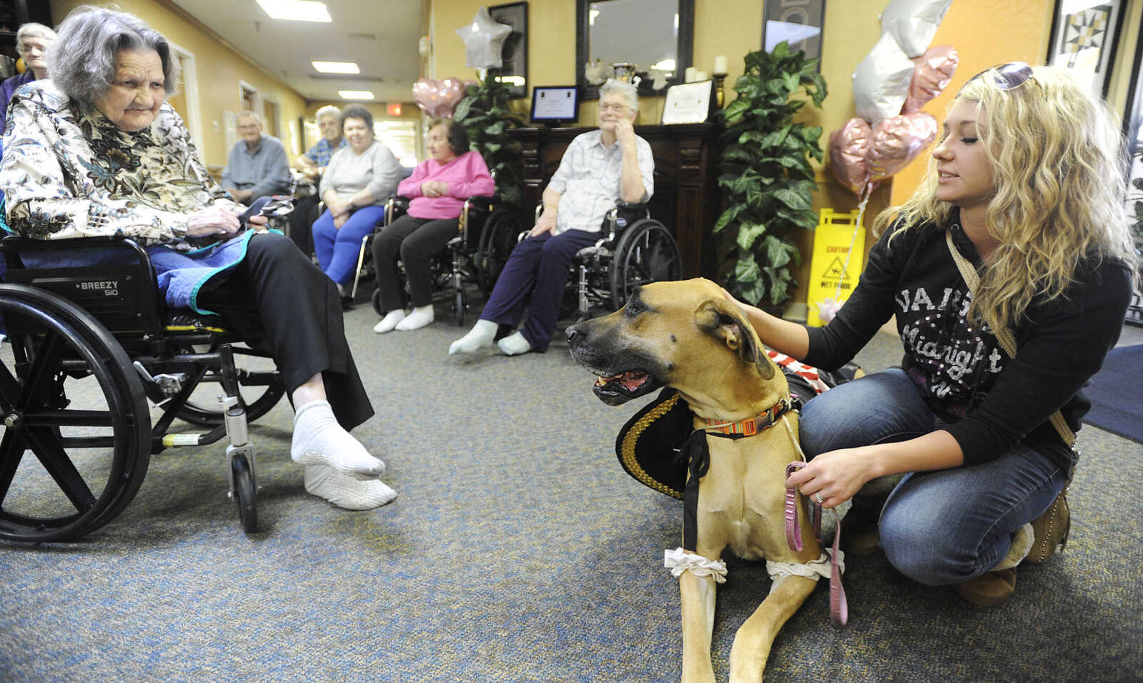 Crysten Urhan, right, and Bella, a Great Dane dressed as a pirate, visit with residents during the Howl-oween Pet Parade Friday, October 26, at the Chaffee Nursing Center, in Chaffee. This is the first time the event, where pets and their owners dressed up in costumes to visit residents at the center, has been held. Registration was free but donations were accepted for the Safe Harbor Animal Sanctuary in Jackson.