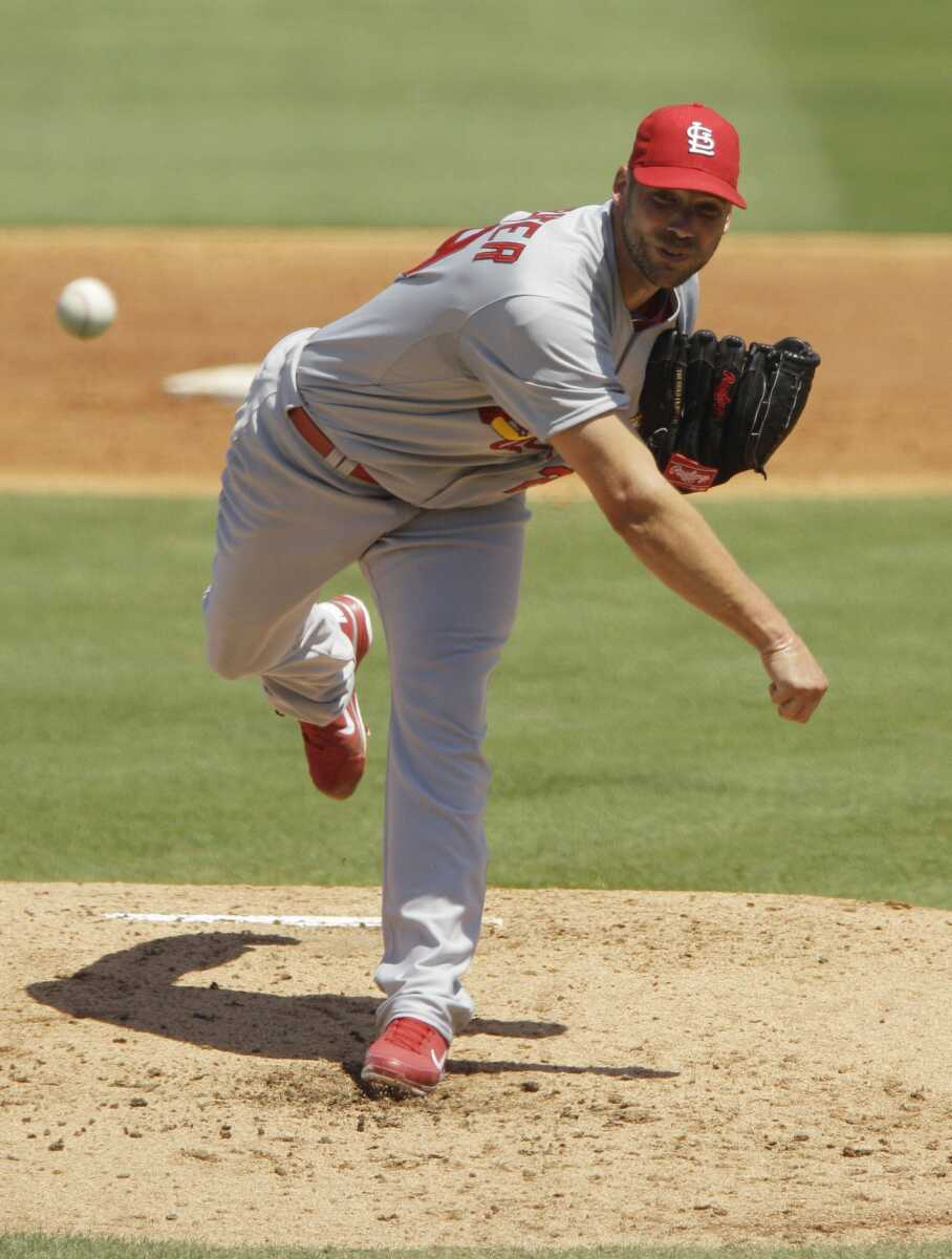 Cardinals starting pitcher Chris Carpenter delivers during the third inning Saturday in Jupiter, Fla. (CARLOS OSORIO ~ Associated Press)