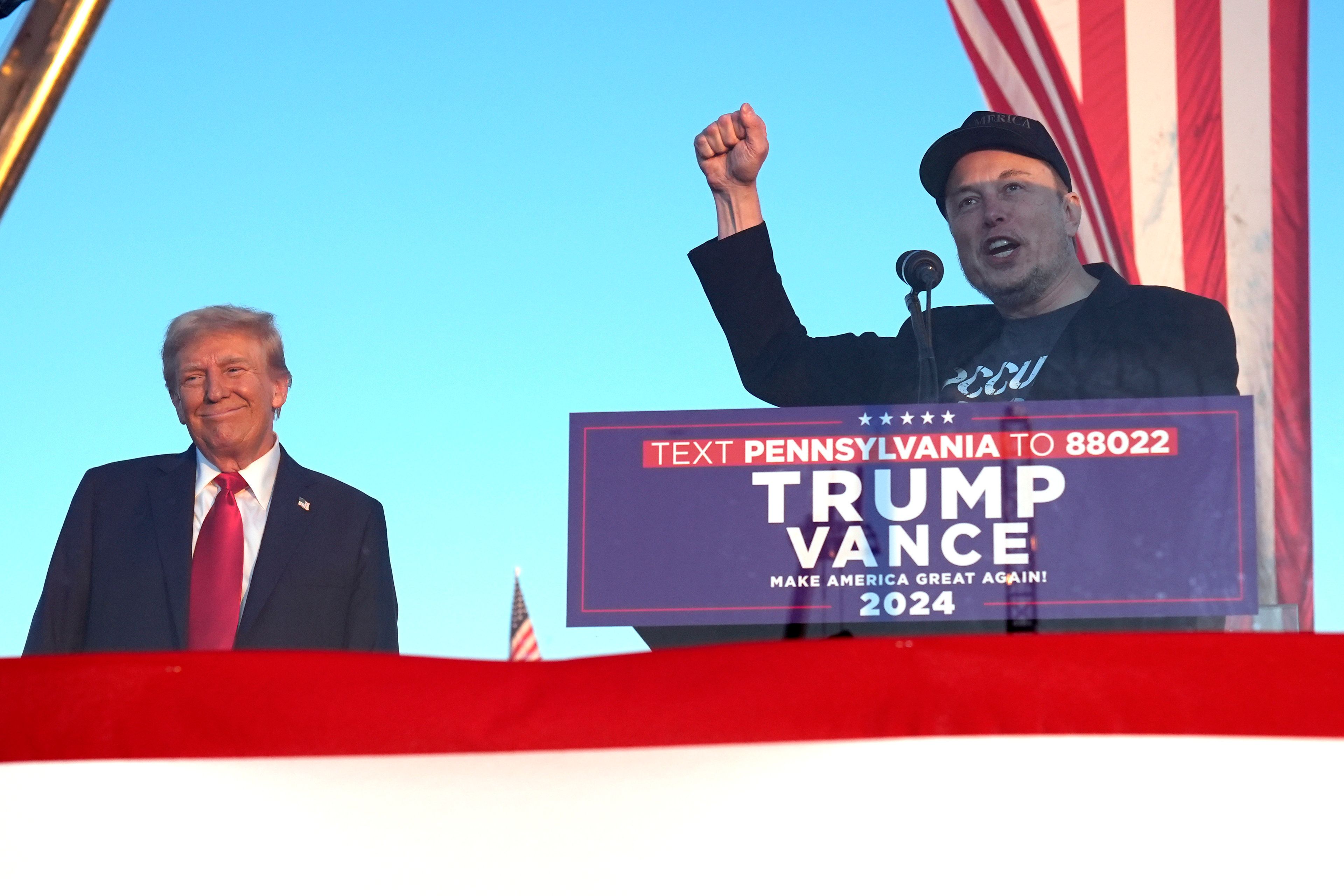 Tesla and SpaceX CEO Elon Musk speaks as Republican presidential nominee former President Donald Trump listens at a campaign event at the Butler Farm Show, Saturday, Oct. 5, 2024, in Butler, Pa. (AP Photo/Alex Brandon)