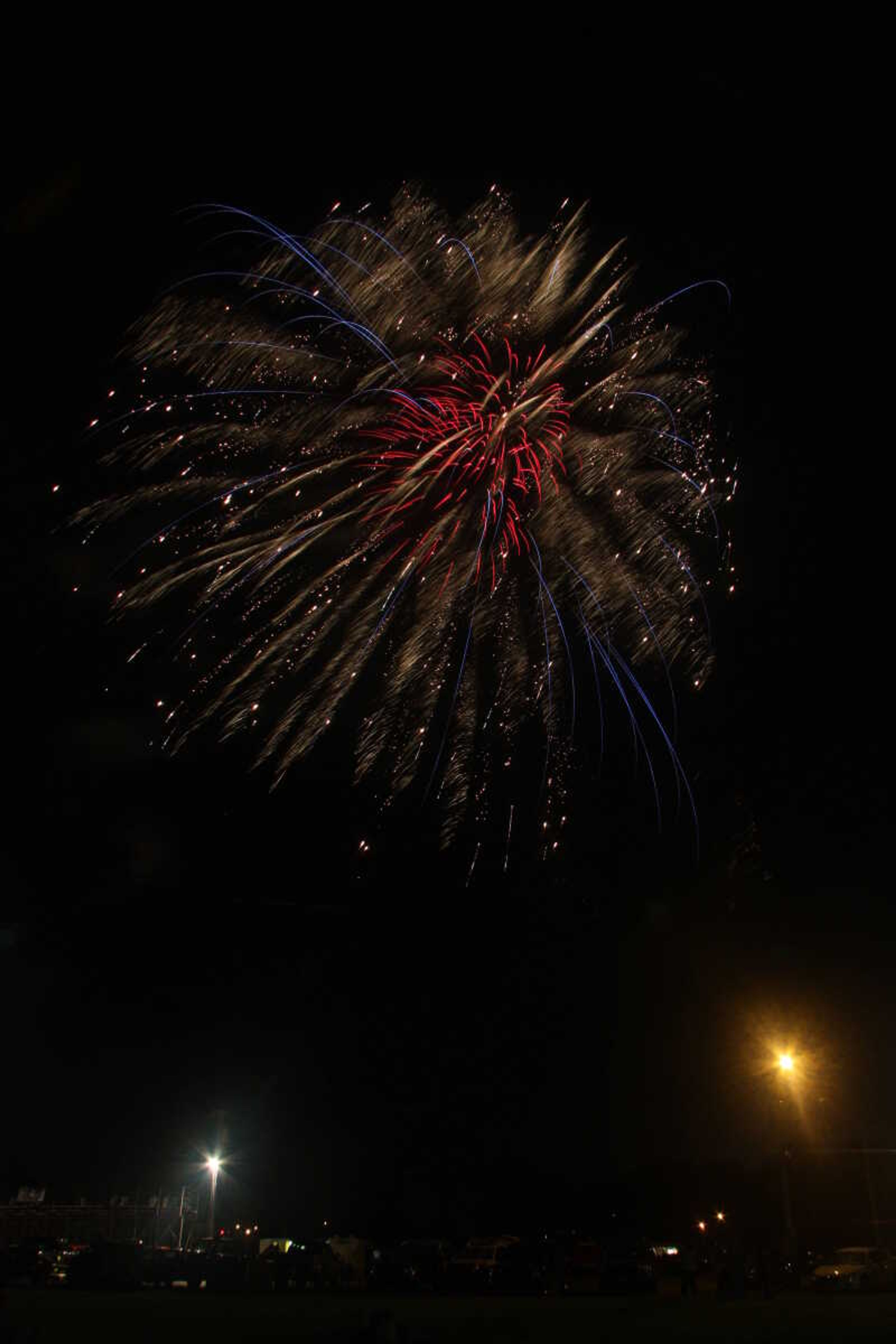 Picture of the fireworks display in Cape Girardeau's Arena Park, taken from a field south of the park.