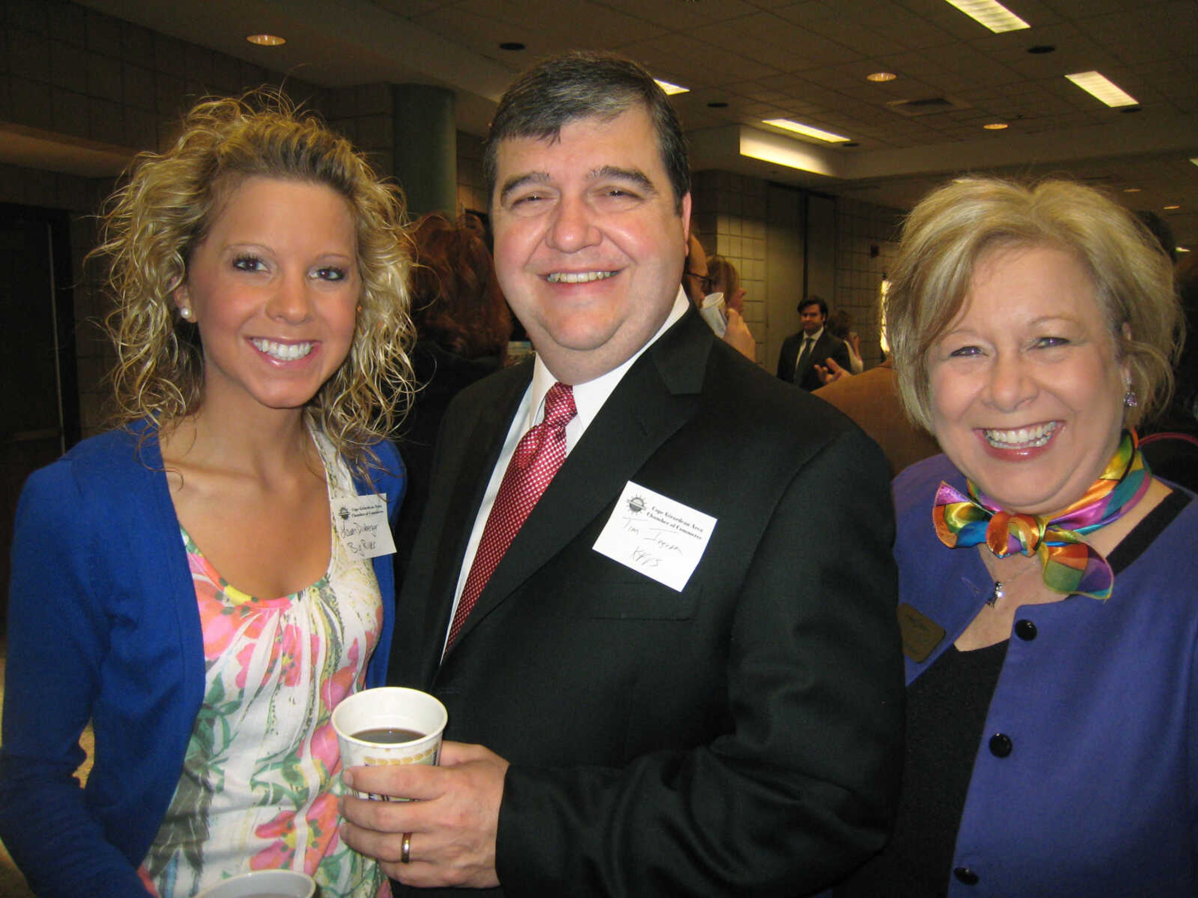 Lauren Dirnberger, left, Big River Telephone; Tim Ingram, KFVS12 and The Heartland's CW; and Cathi Schlosser, Alliance Bank, pose at the Cape Girardeau Area Chamber of Commerce First Friday Coffee, April 5 at the Show Me Center.