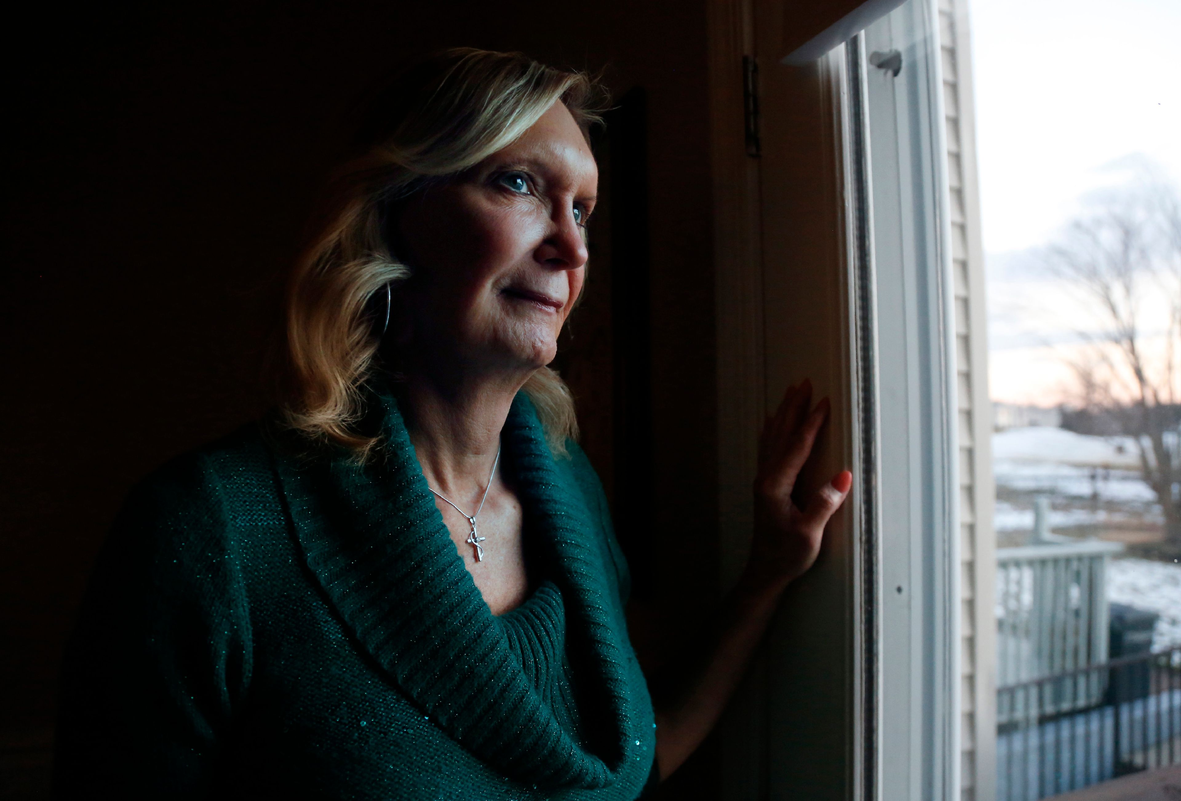 FILE - Christine Zuba, who came out as a transgender woman at age 58, stands for a portrait at her home in Blackwood, N.J., on Monday, Feb. 14, 2022. (AP Photo/Jessie Wardarski, File)