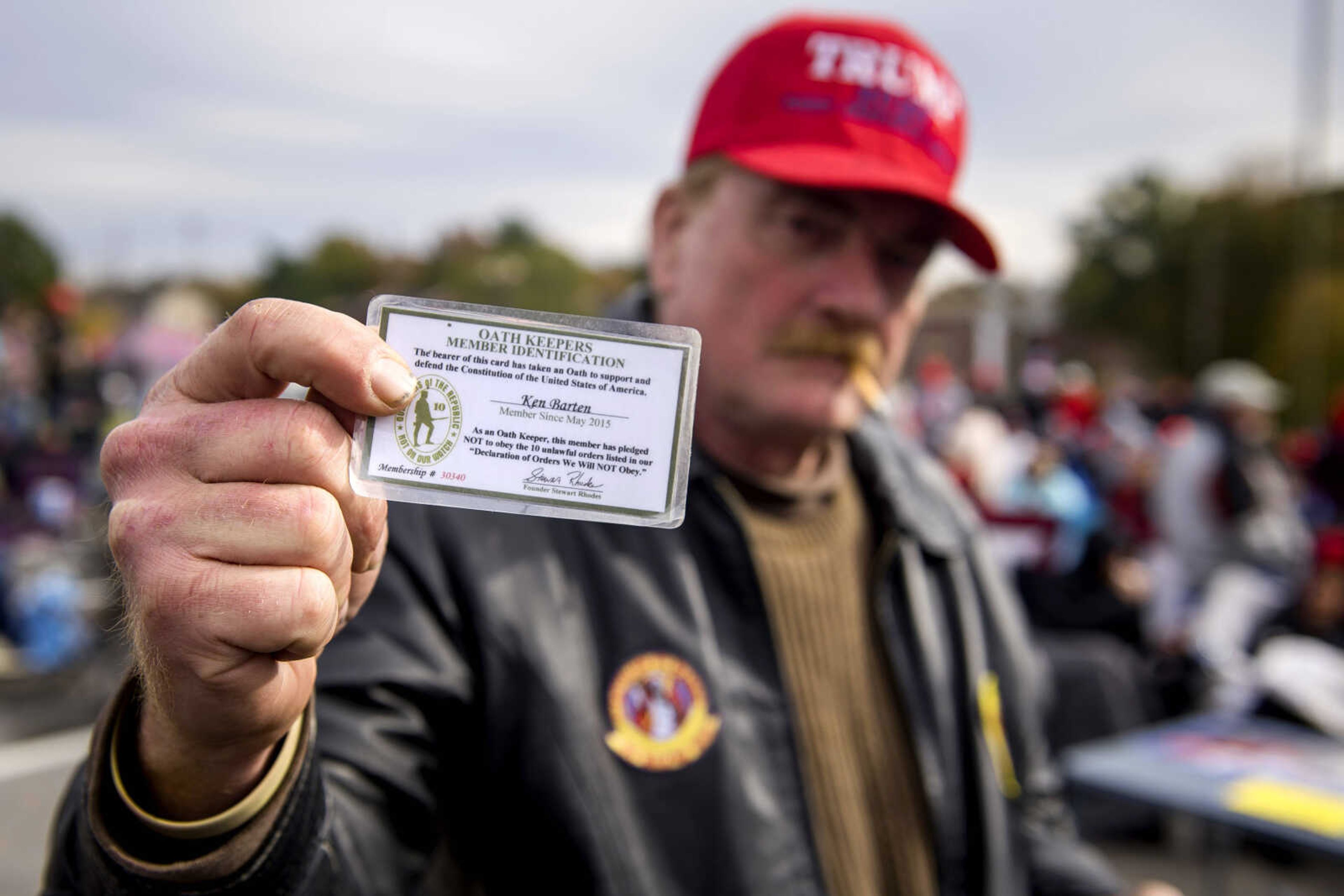 Ken Barten of Arnold, Mo., displays his Oath Keepers membership identification card outside the Show Me Center Monday while waiting for the Make America Great Again rally in Cape Girardeau. 
Barten, who said Monday's rally was the 25th Trump event he'd attended, said he enjoys the President's rallies because "when you're out in public, it's really hard to be a conservative Republican... you meet people (at Trump rallies) and you can talk to them. I'm willing to stand here and have a debate. You might not agree on everything, but you can disagree and shake hands and walk away. People today have forgotten how to talk to each other."