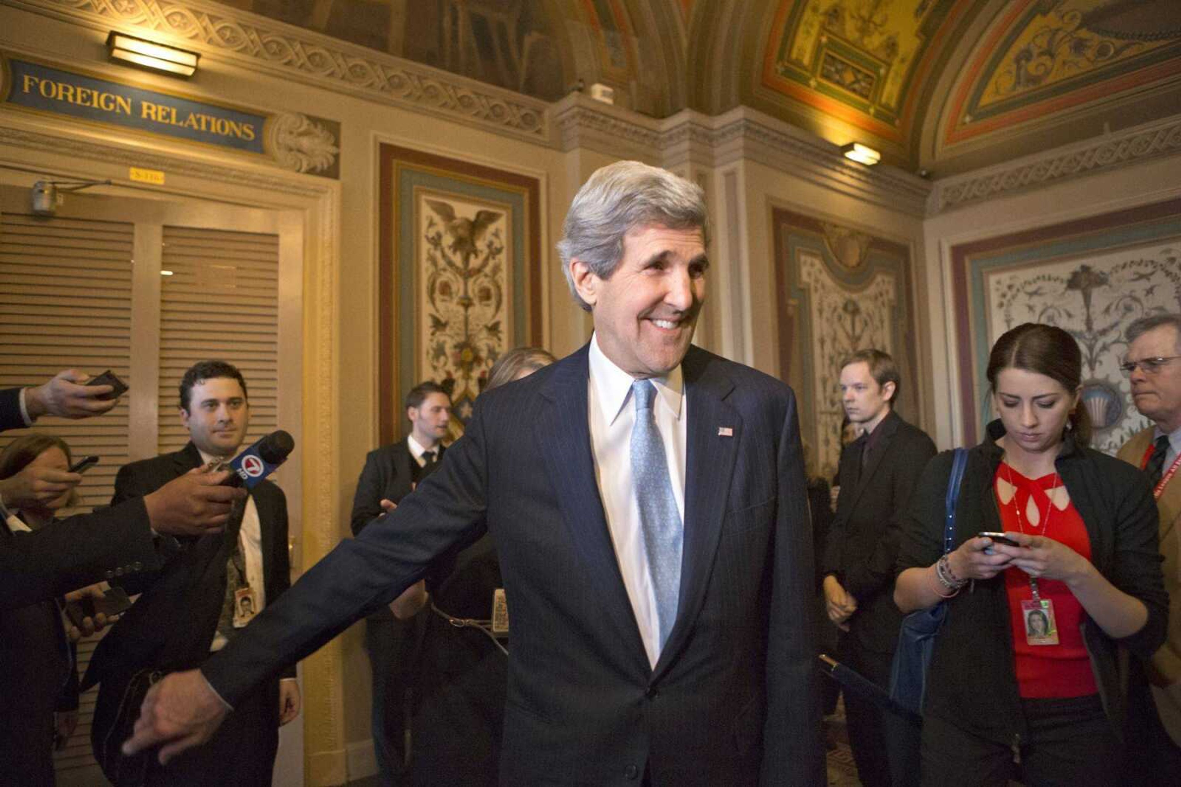 Sen. John Kerry, D-Mass., emerges after a unanimous vote by the Senate Foreign Relations Committee approving him to become America&#8217;s next secretary of state Tuesday on Capitol Hill in Washington. (J. Scott Applewhite ~ Associated Press)