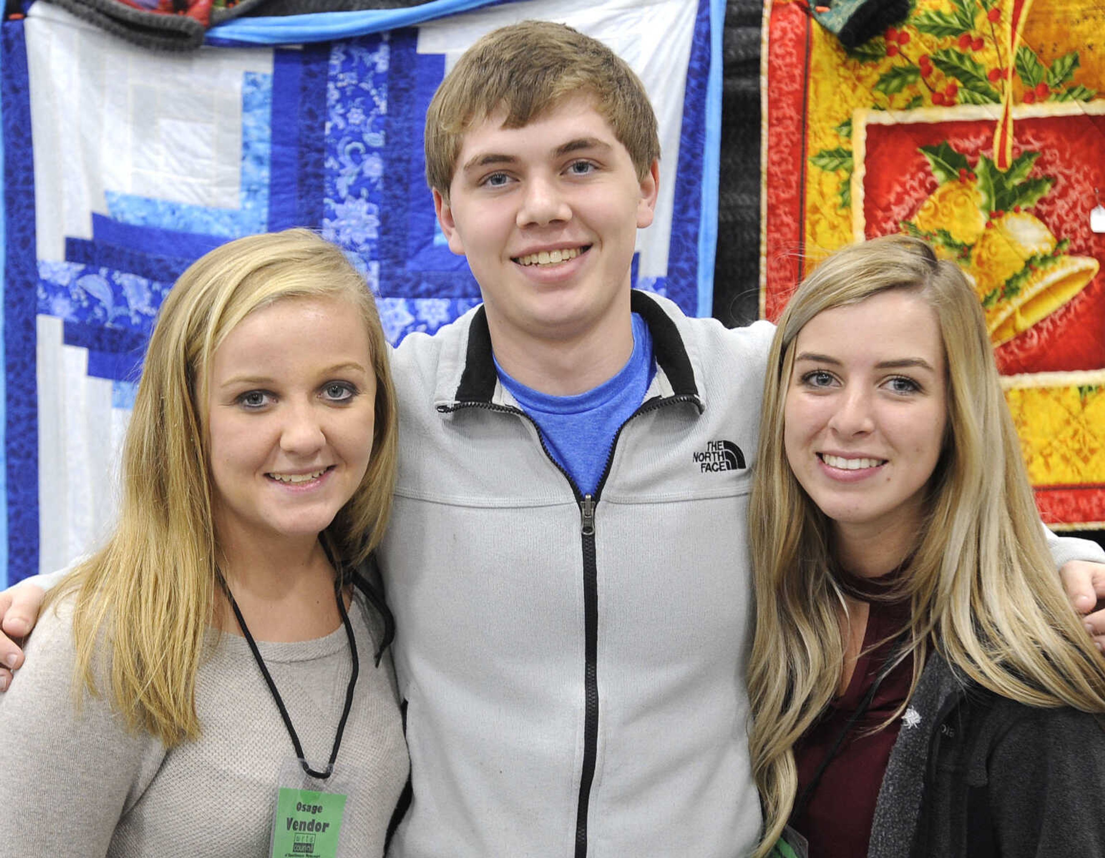 FRED LYNCH ~ flynch@semissourian.com
Chelsy McDonald, left, Brandon Abner and Jordan Head pose for a photo Saturday, Nov. 18, 2017 at the Christmas Arts & Crafts Extravaganza in the Osage Centre.