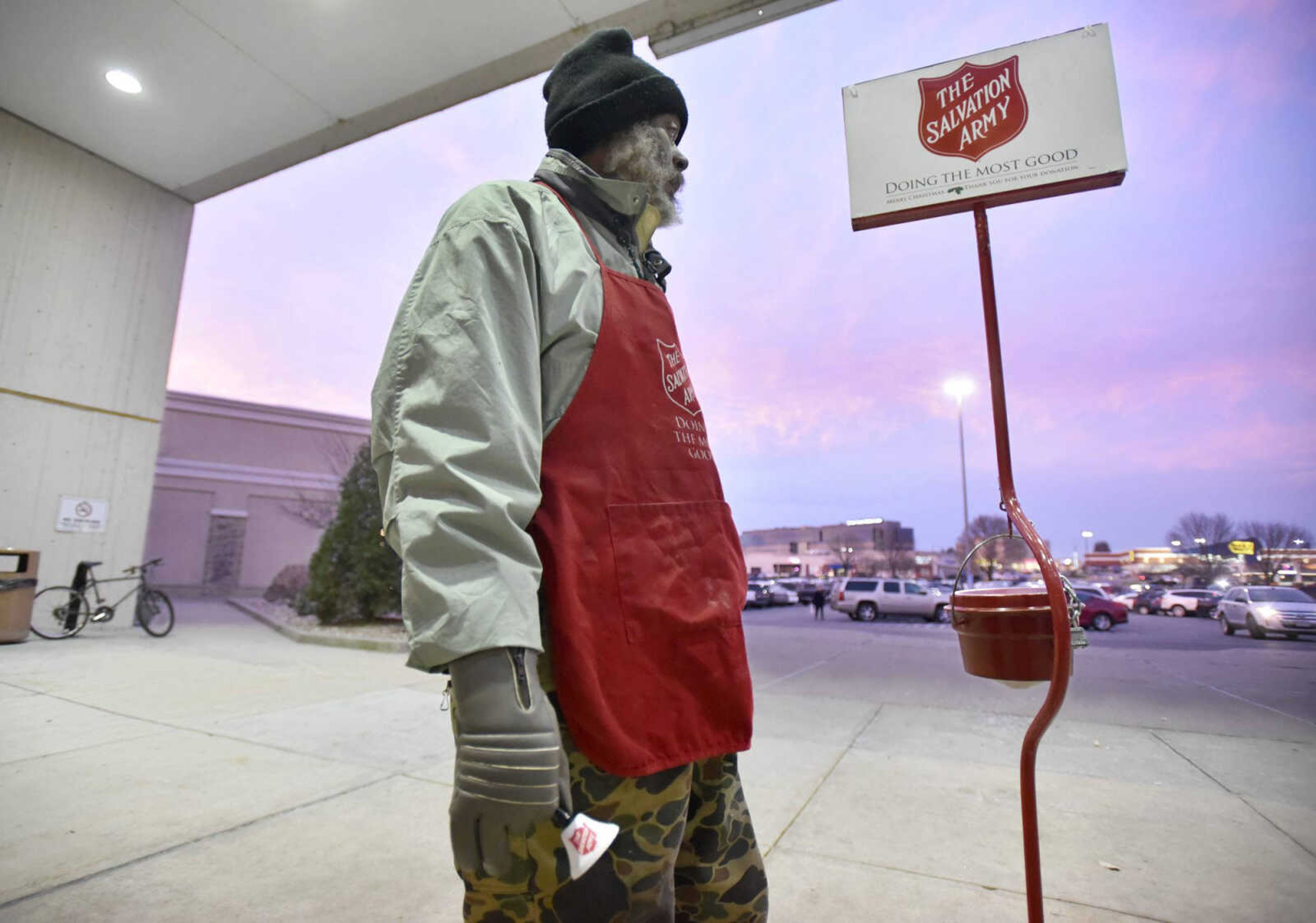 Spicer rings the red-kettle bell for the Salvation Army on Wednesday outside West Park Mall in Cape Girardeau. 