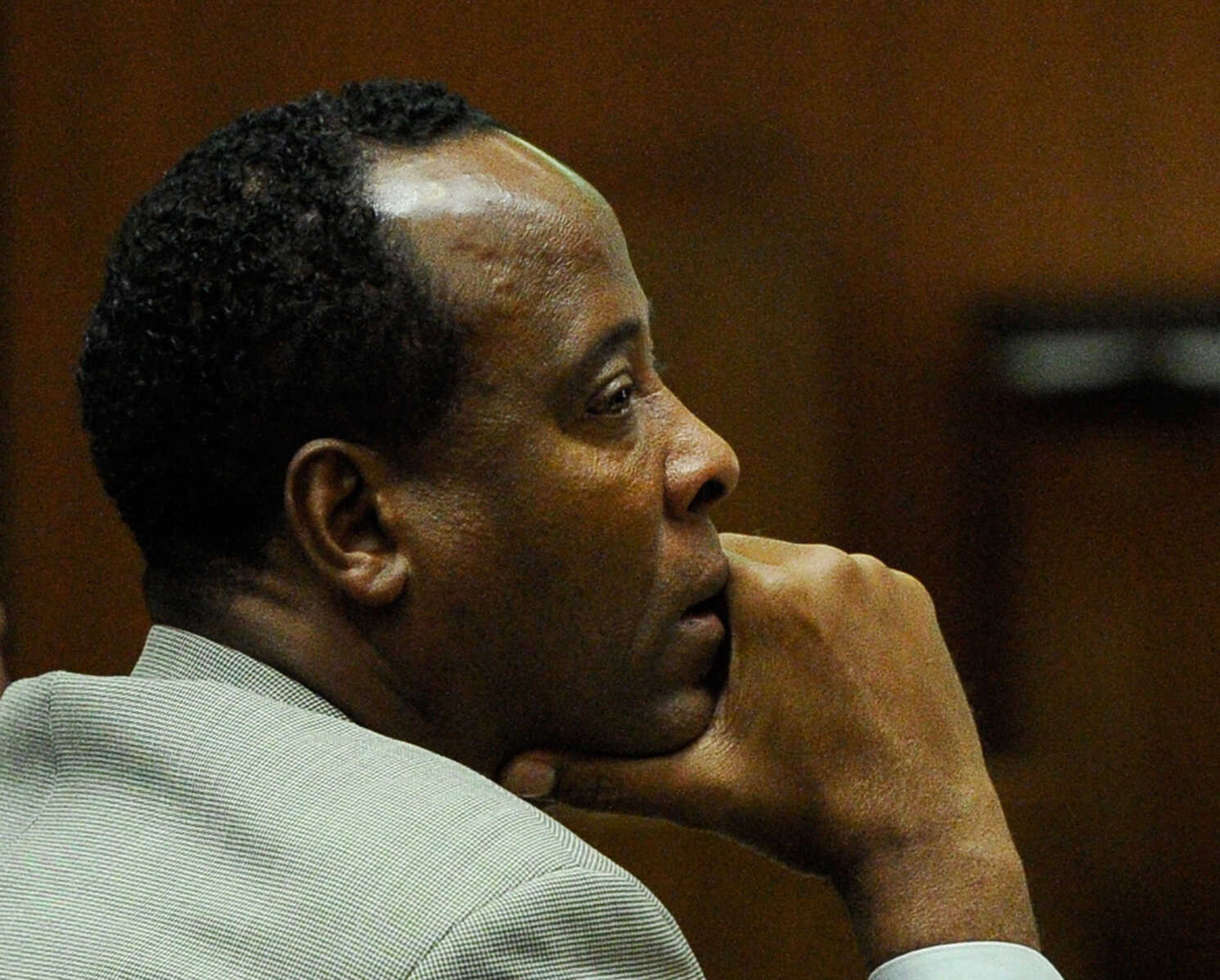 FILE - In a Thursday, Nov. 3, 2011 file photo, Dr. Conrad Murray listens as defense attorney Ed Chernoff, not pictured, gives the defense's closing arguments during the final stage of Conrad Murray's defense in his involuntary manslaughter trial in the death of singer Michael Jackson at the Los Angeles Superior Court in Los Angeles, Calif. The juryis set to resume deliberations Monday, Nov. 7, 2011 after spending their first day in discussions Friday without reaching a verdict.   (AP Photo/Kevork Djansezian, Pool, File)