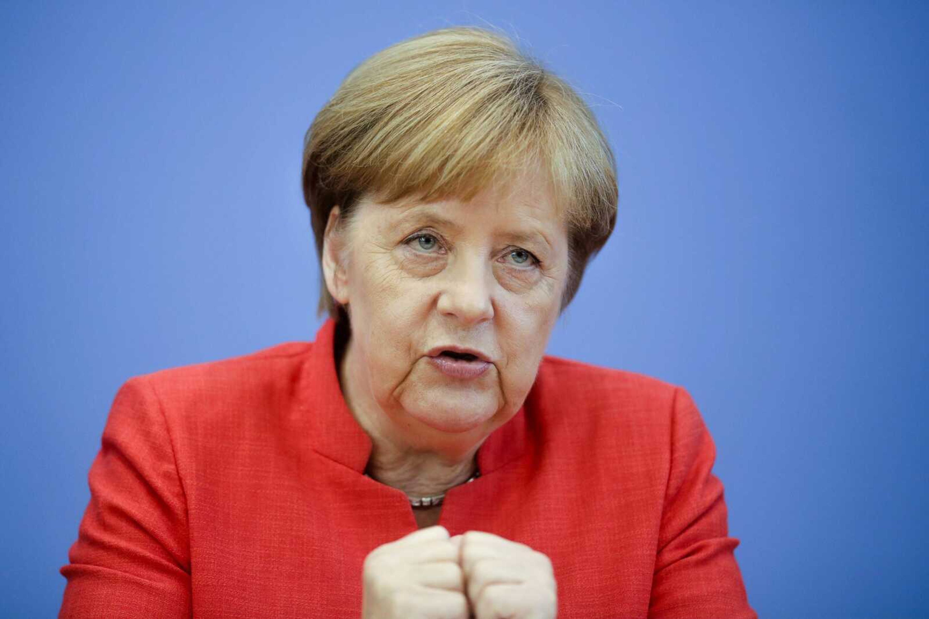 German Chancellor Angela Merkel speaks during her annual summer news conference Friday at the Bundespressekonferenz in Berlin.