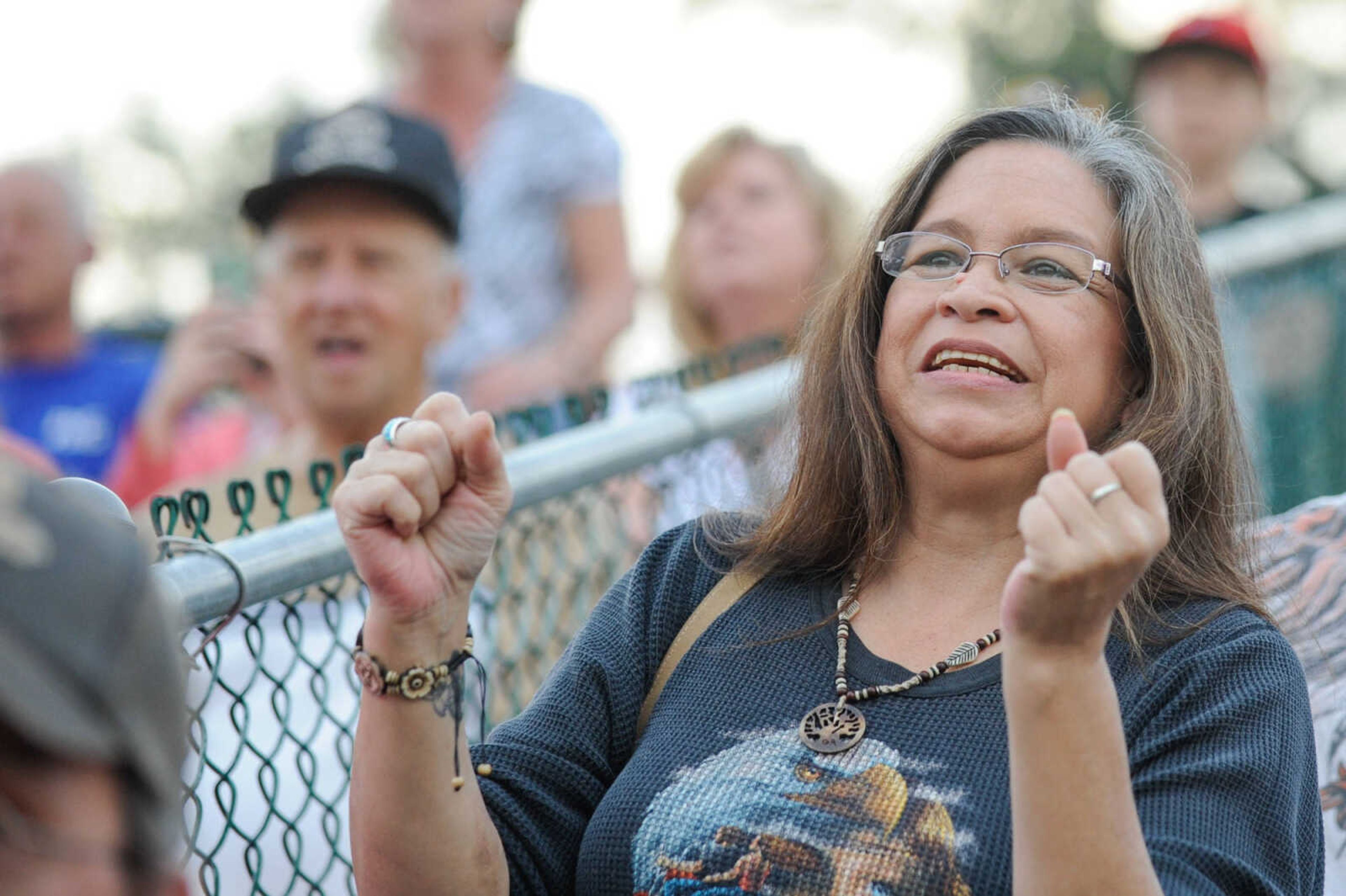 GLENN LANDBERG ~ glandberg@semissourian.com

Maria Martinez anxiously watches the mule-jumping contest at the East Perry Community Fair Saturday, Sept. 26, 2015 in Altenburg, Missouri.