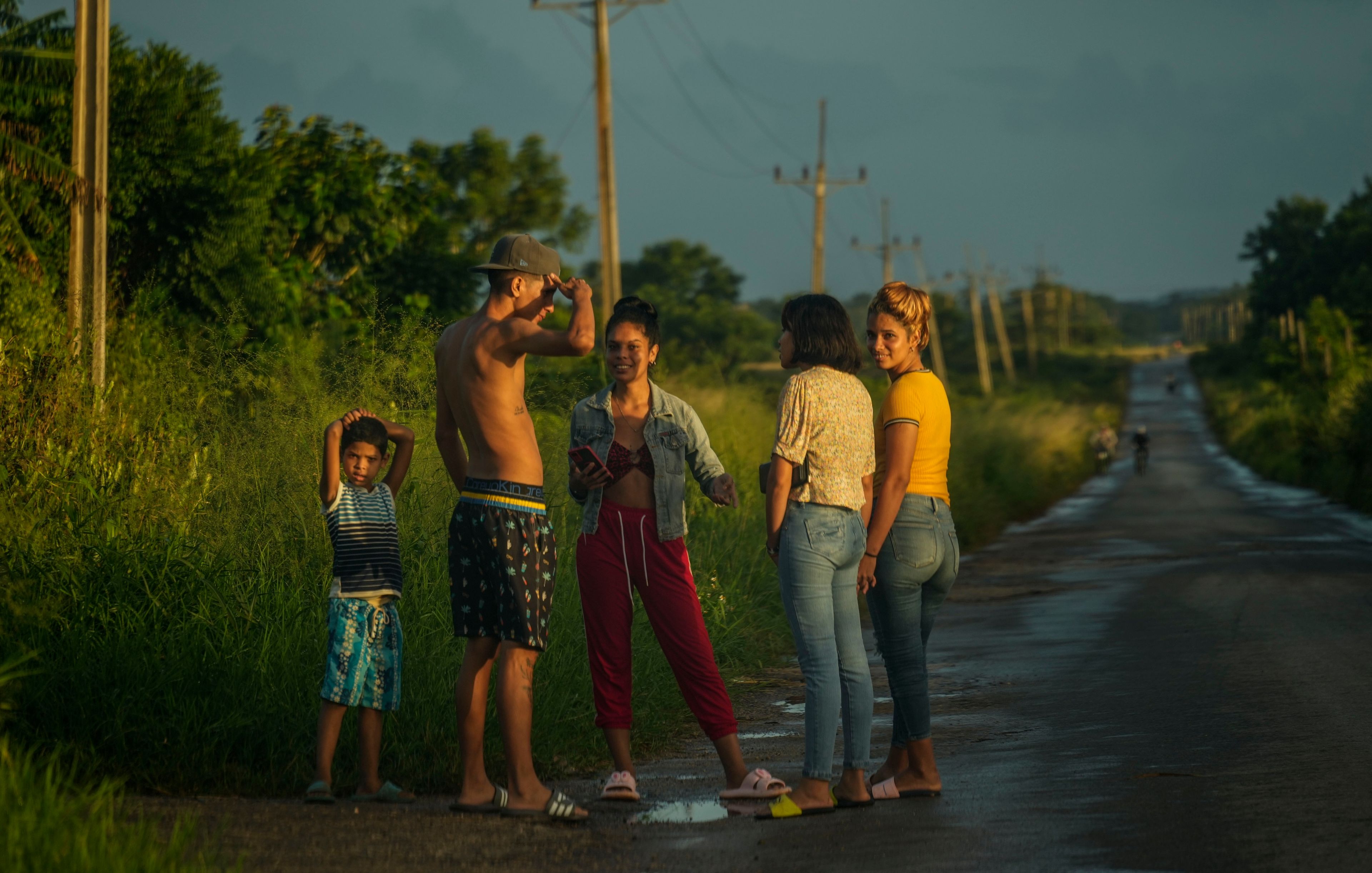 FILE - People chat on the side of a road in San Jose de las Lajas, Cuba, Oct. 22, 2024. (AP Photo/Ramon Espinosa, File)