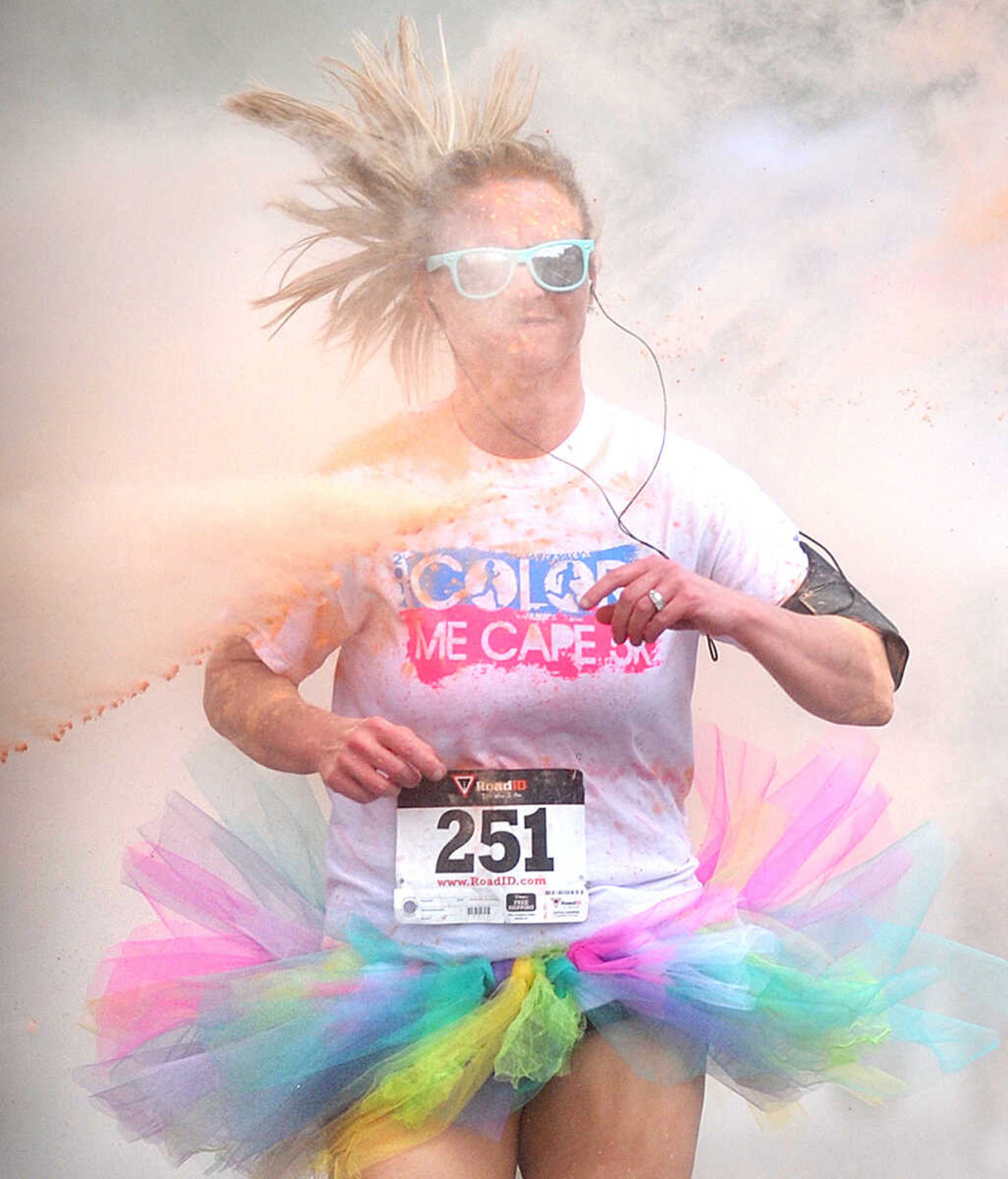 LAURA SIMON ~ lsimon@semissourian.com

Participants in the Color Me Cape 5K are sprayed with orange powder at the first color station on Good Hope Street, Saturday, April 12, 2014, in Cape Girardeau.