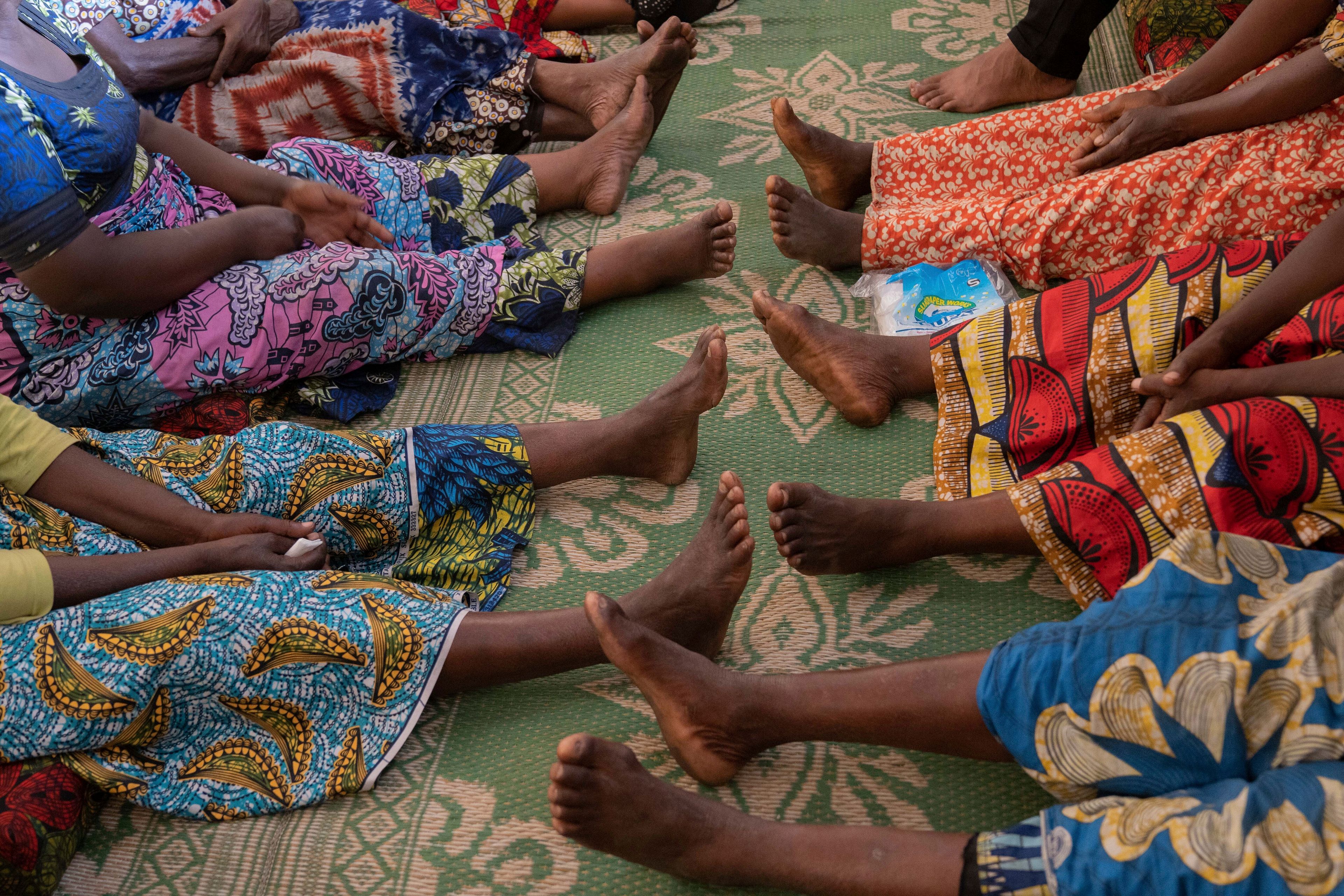 Nelly Shukuru, 51, and others receive counseling in Goma, Democratic Republic of the Congo, Tuesday, Aug. 27, 2024. (AP Photo/Moses Sawasawa)