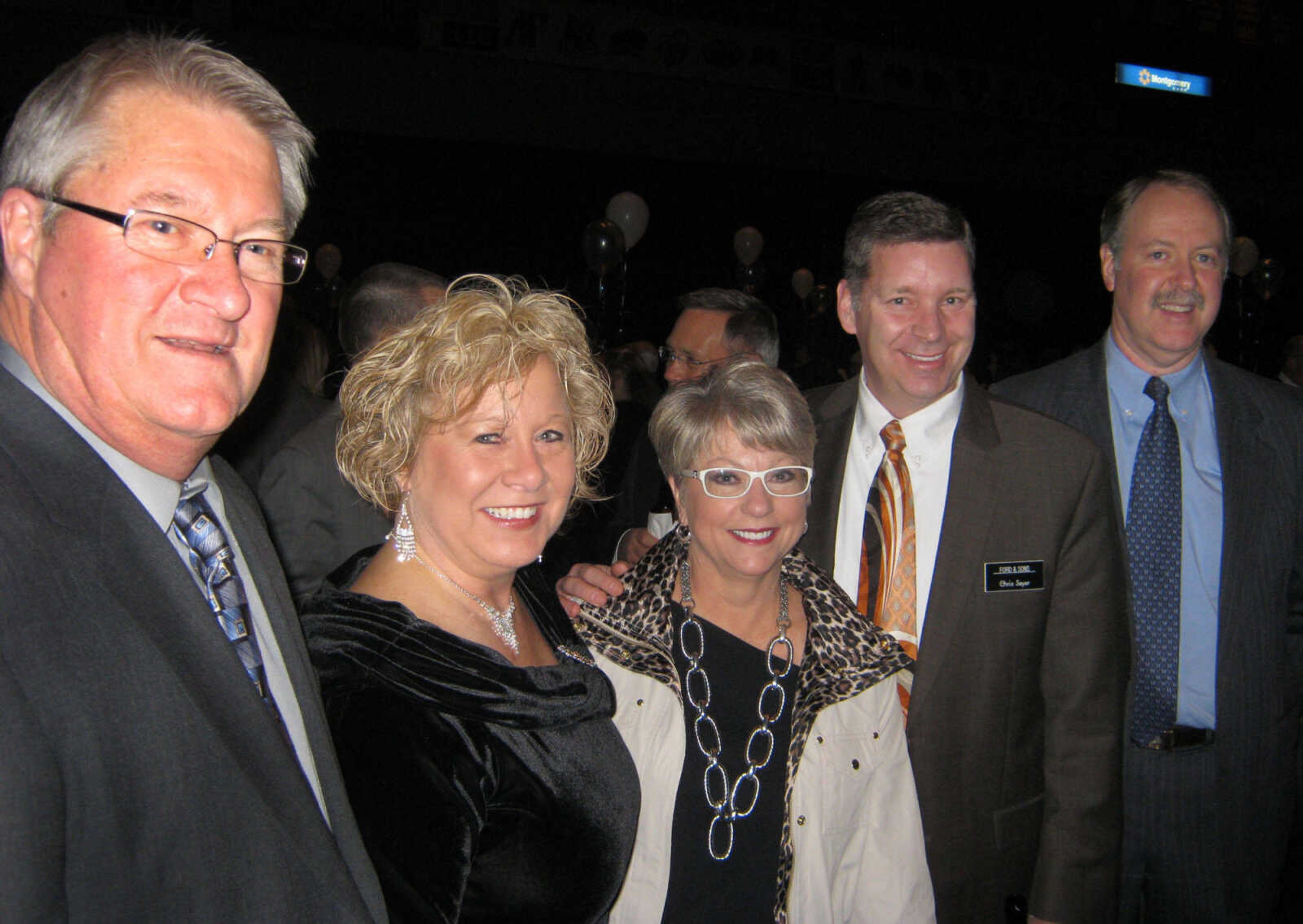 Leo Nenninger, left, DeCota Electric; Cathi Schlosser, Alliance Bank; Debbie Essner, Leet Eye Care; Chris Seyer, Ford & Sons;
and Mike Unverferth, CPU, Inc. pose at the Cape Girardeau Area Chamber of Commerce annual banquet Friday, Jan. 27 at the Show Me Center.