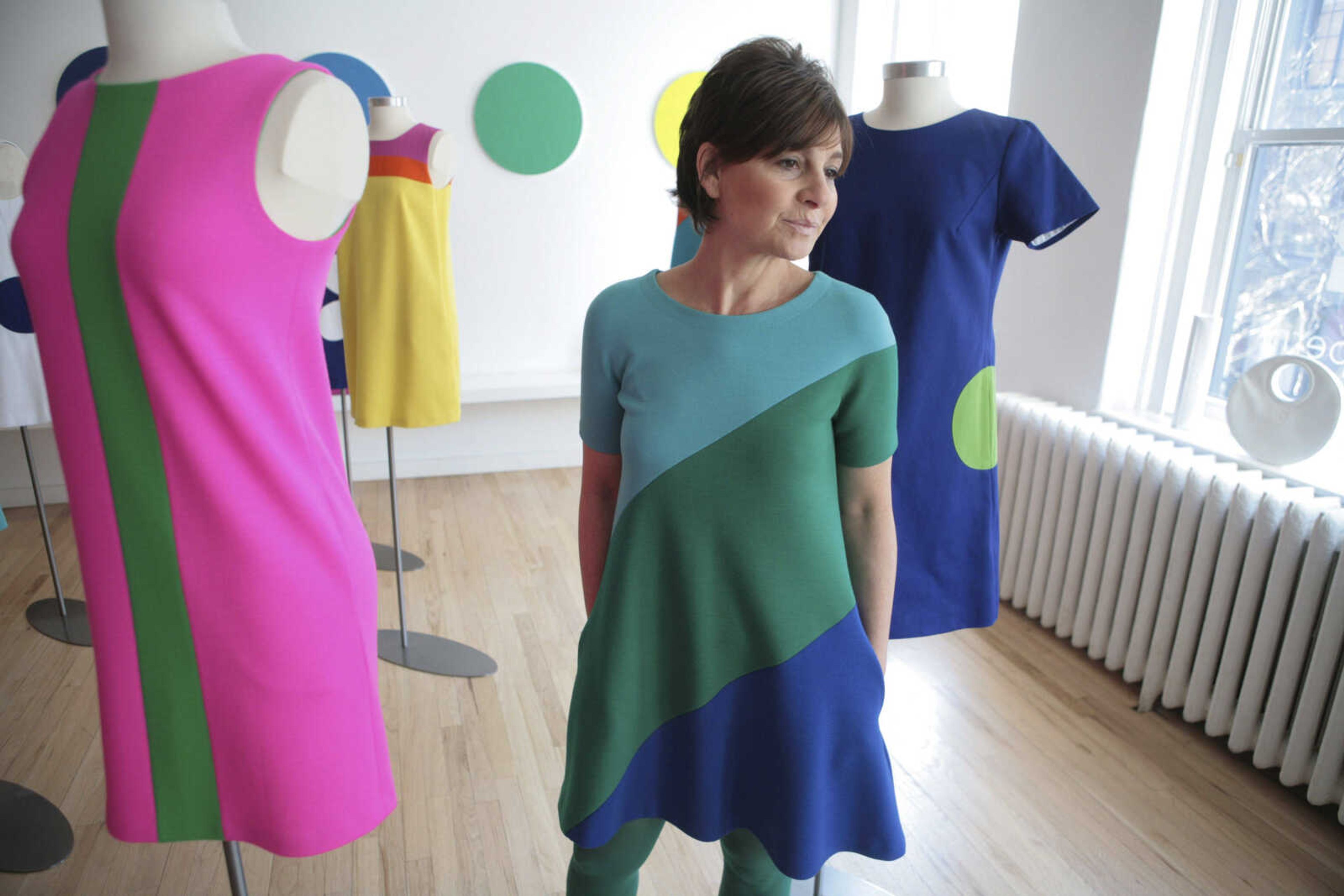 Designer Lisa  Perry poses at her studio in the SoHo neighborhood of New York. The message from the fashion world isn't just to wear color, it's to wear several colors at once. One trend is colorblocking, putting chunks of color all over your outfit in a very mod, Mondrian sort of way. (AP Photo/Bebeto Matthews)