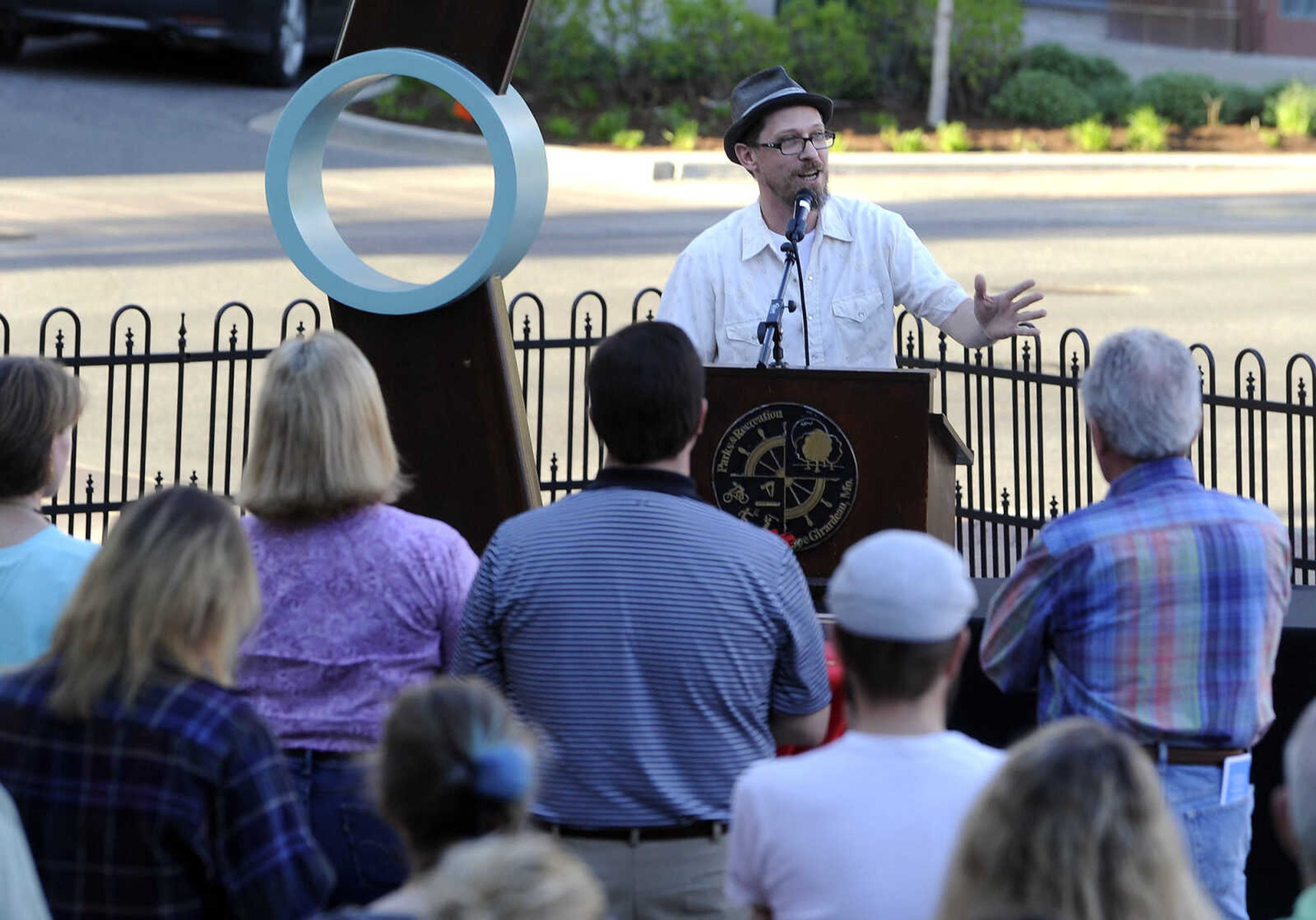 Chris Wubbena speaks at the opening reception for the Cape Girardeau Outdoor Sculpture Exhibit on Friday, April 15, 2016 at the Vasterling Suites Courtyard in Cape Girardeau.