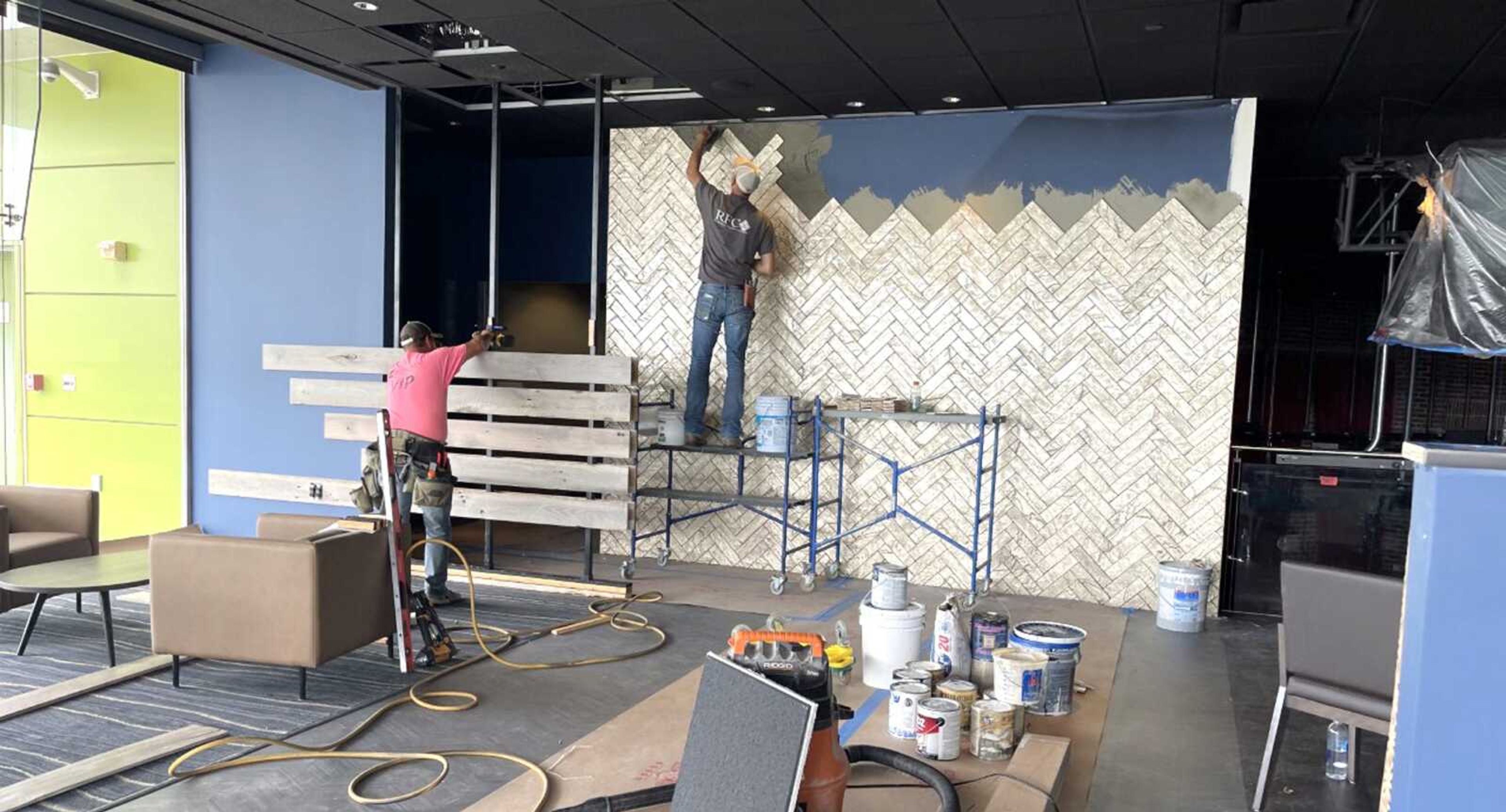 Workers from Zoellner Construction and Richardet Floor Covering remodel the area of Century Casino formerly known as Keller's, which will will be renamed Beacon 53 when it reopens later this month.