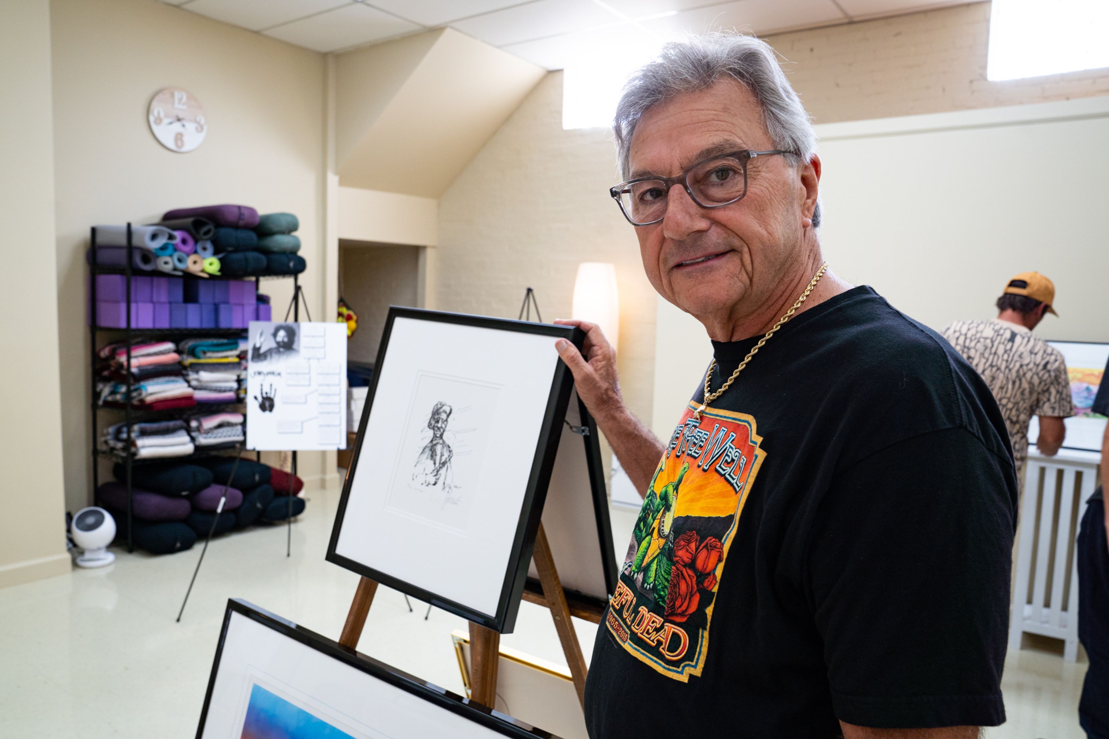 Keith Holloway stands by one of his favorite Jerry Garcia art pieces on Friday, Sept. 20 at the Yoga East Healing Arts Studio. Holloway showed his collection of Jerry Garcia art to raise funds for the Jack Finney Foundation.