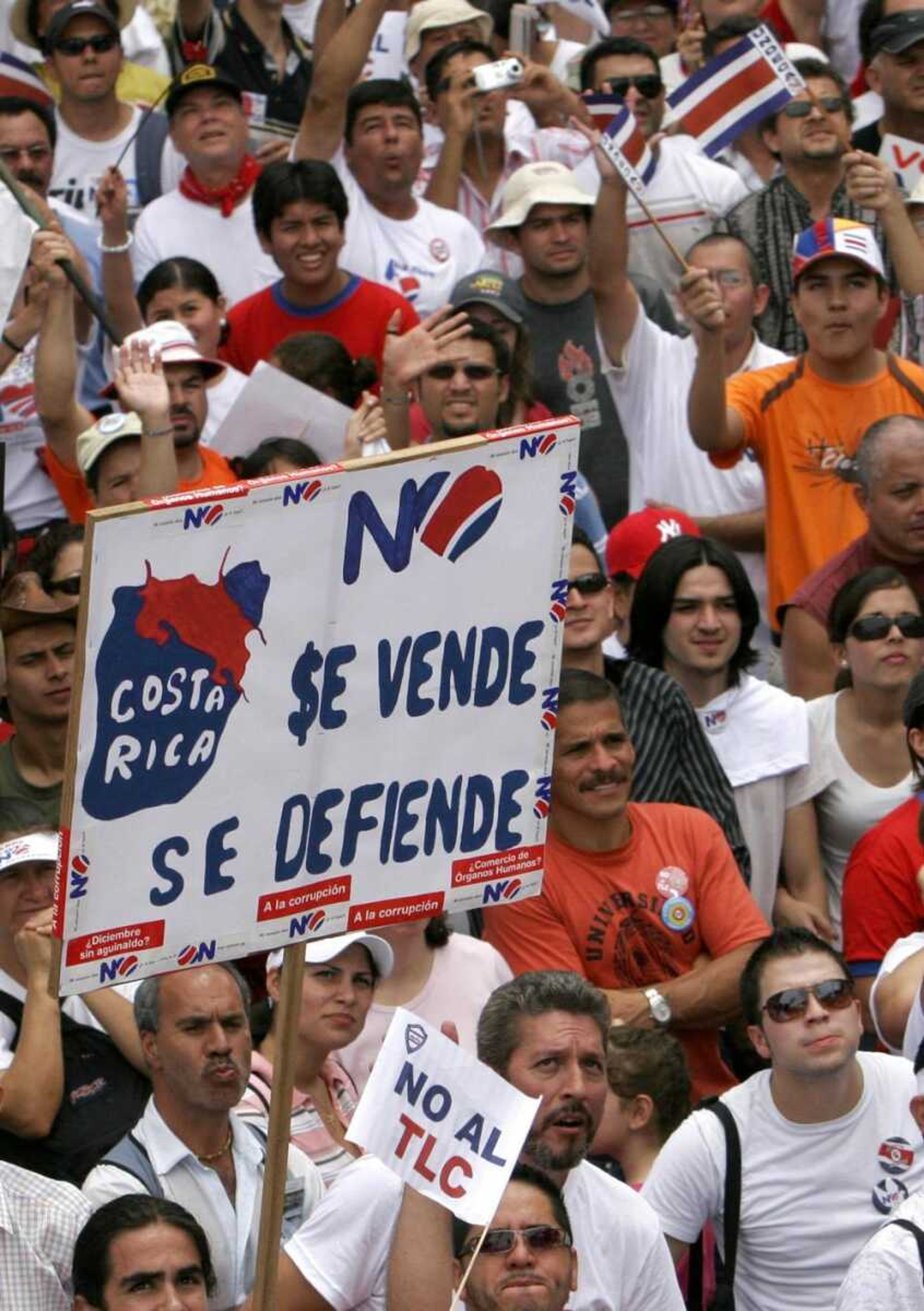 Costa Ricans protested Sunday against the Free Trade Agreement between the U.S., Central America and the Dominican Republic in San Jose, Costa Rica. The sign reads "Costa Rica is not for sale, we will defend Costa Rica." (Kent Gilbert ~ Associated Press)