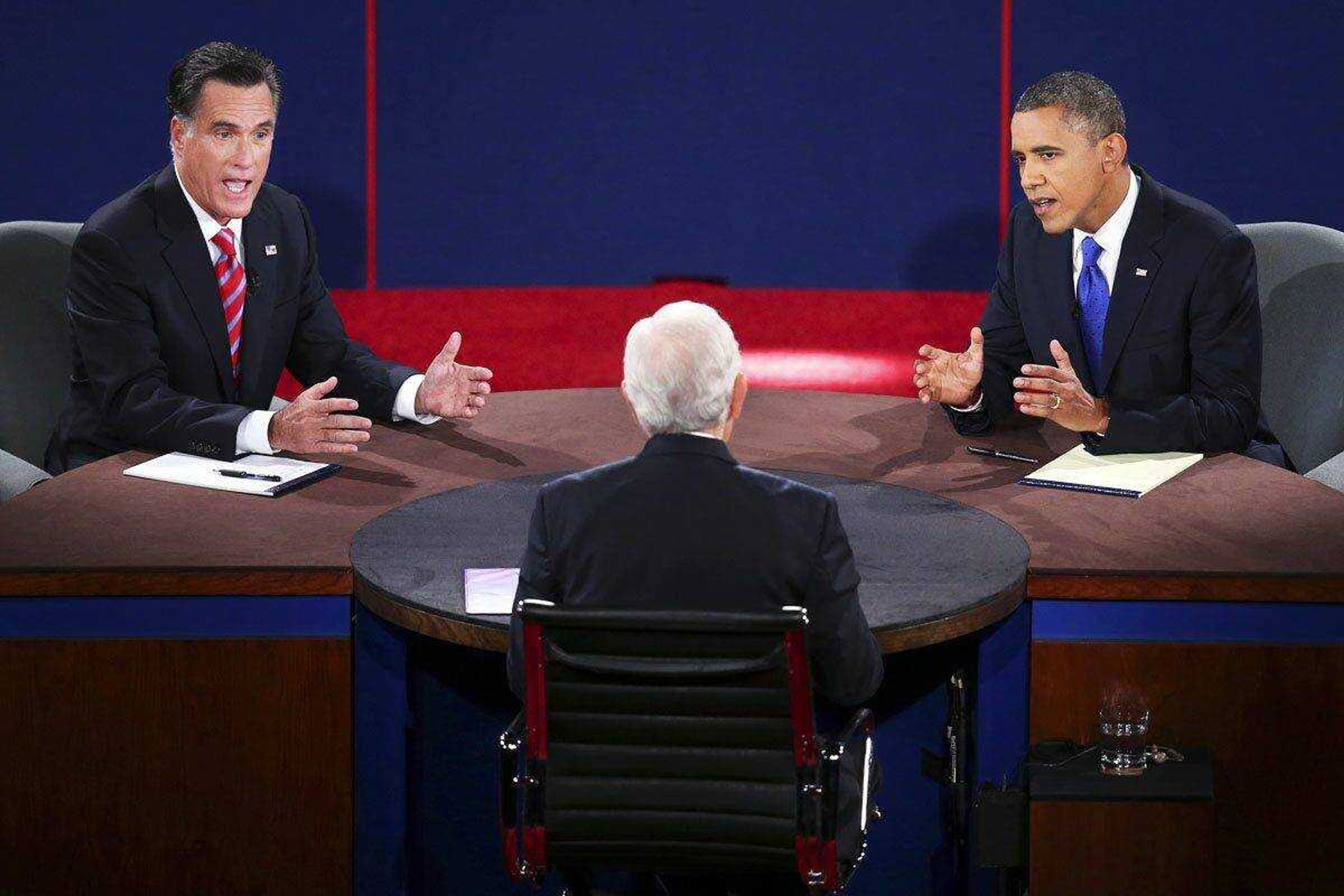 Republican presidential nominee Mitt Romney and President Barack Obama answer a question during the third presidential debate at Lynn University on Oct. 22 in Boca Raton, Fla. (Win McNamee ~ Pool)